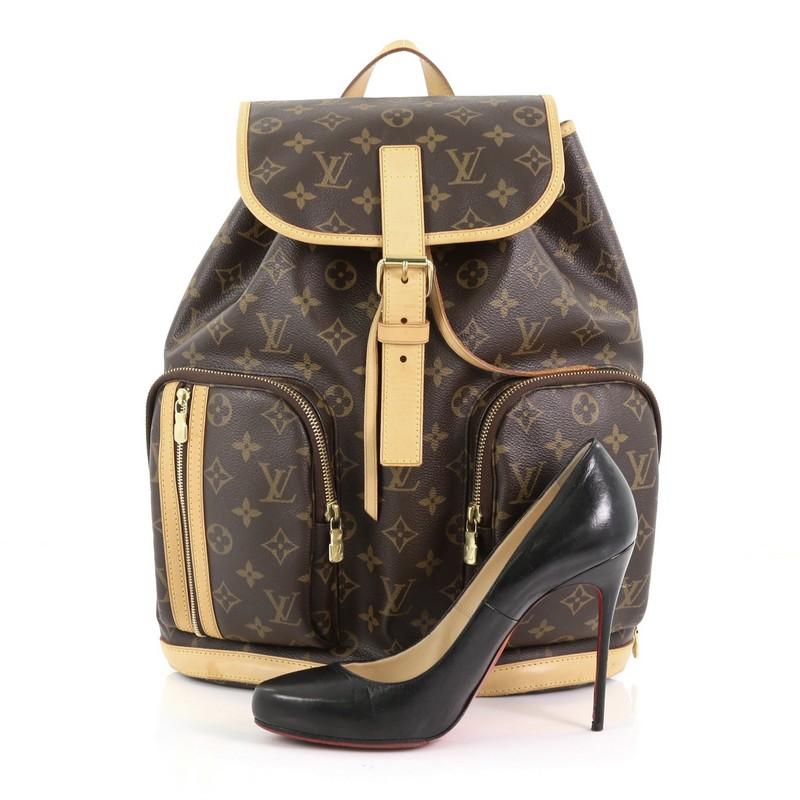 This Louis Vuitton Bosphore Backpack Monogram Canvas, crafted from brown monogram coated canvas with vachetta leather trims, features exterior front zip pockets, dual adjustable canvas straps, and gold-tone hardware. Its top flap with belt and
