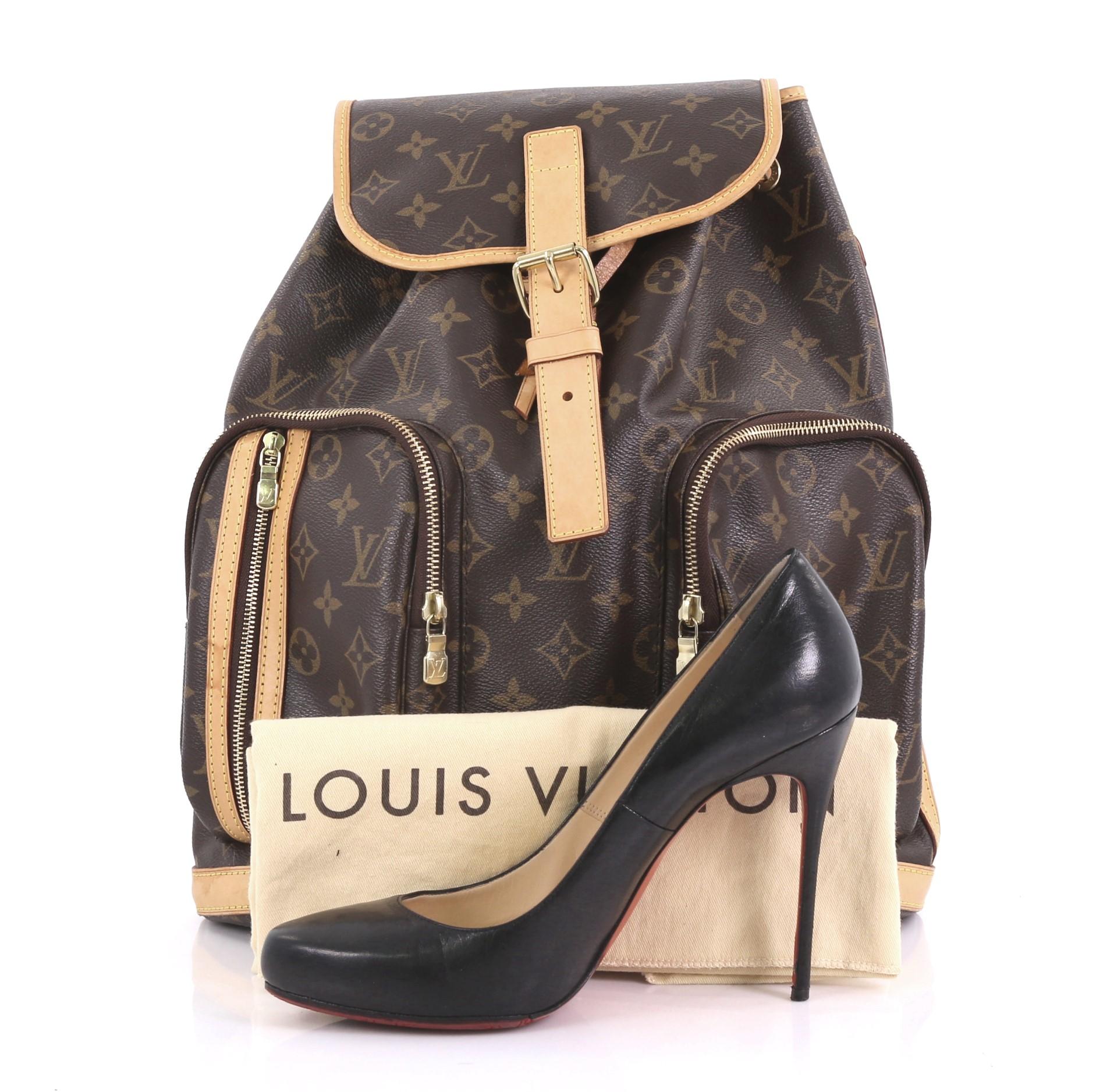 This Louis Vuitton Bosphore Backpack Monogram Canvas, crafted from brown monogram coated canvas with vachetta leather trim, features exterior front zip pockets, dual adjustable canvas straps, and gold-tone hardware. Its top flap with belt and