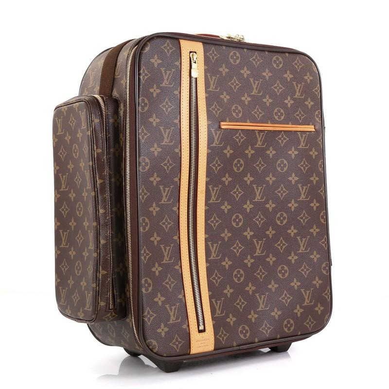 This Louis Vuitton Bosphore Luggage Monogram Canvas 50, crafted in brown monogram coated canvas, features a leather top handle, plastic and leather retractable handle, exterior zip and slip pockets and gold-tone hardware. Its zip closure opens to a