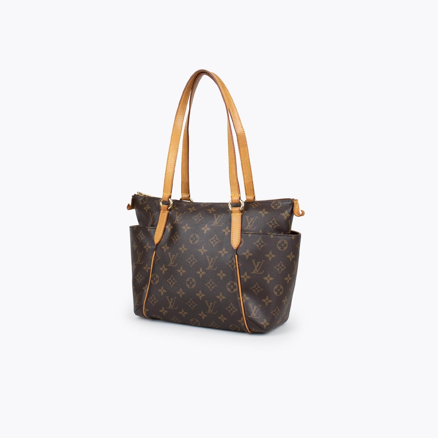 Brown and tan monogram coated canvas Louis Vuitton Bosphore Messenger PM with

- Brass hardware
- Single flat adjustable canvas shoulder strap
- Tan Vachetta leather trim
- Dual exterior pockets; one with zip closure at front flap, brown canvas