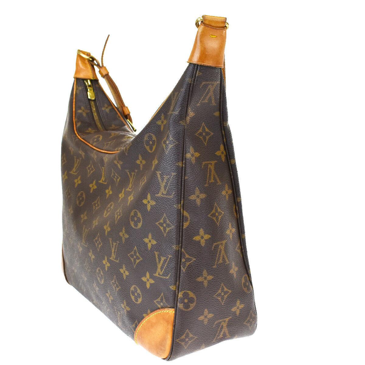 This is an authentic, pre-owned LOUIS VUITTON Boulogne 35 bag. 
 Its a classic hobo-style handbag for everyday. This , featured in the Monogram canvas with a vachetta leather trim .It has a wide shoulder strap for comfort and support and gold-tone