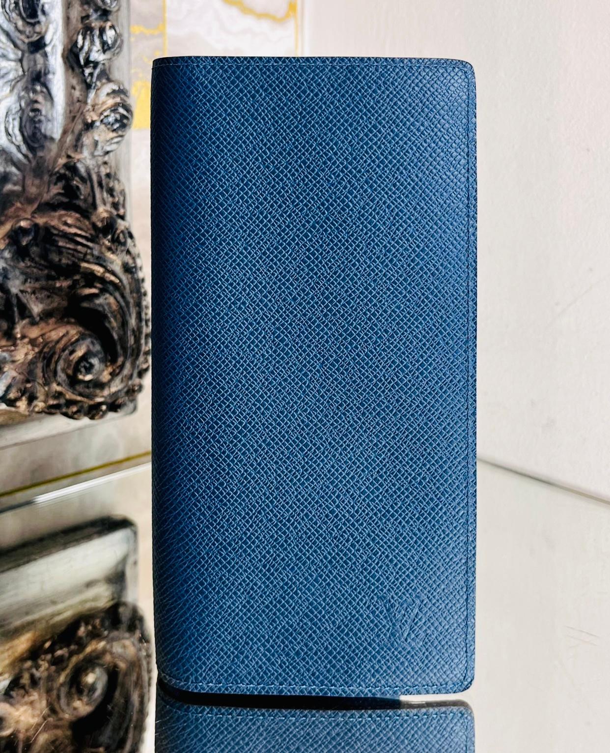Louis Vuitton Brazza Leather Wallet

Blue wallet crafted from the brand's signature Taiga leather.

Designed with 'LV' logo embossed to the corner and silver 'Louis Vuitton' engraved zipper.

Styled with zipped compartment for coins, multiple card