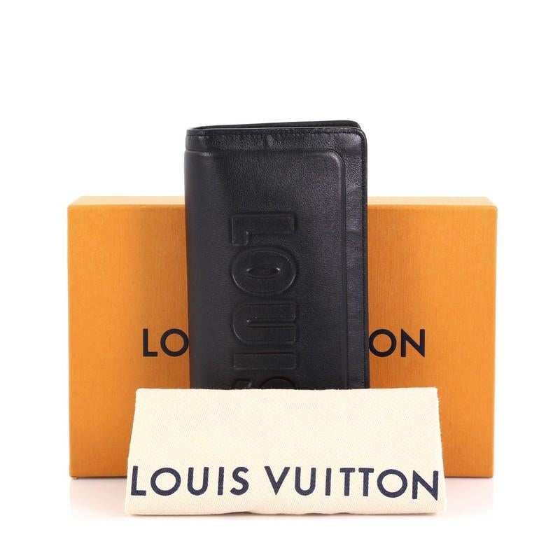 This Louis Vuitton Brazza Wallet Dark Infinity Leather, crafted in black leather, features embossed Louis Vuitton signature and black-tone hardware. It opens to a black leather interior with multiple card slots and zip and slip pockets. Authenticity