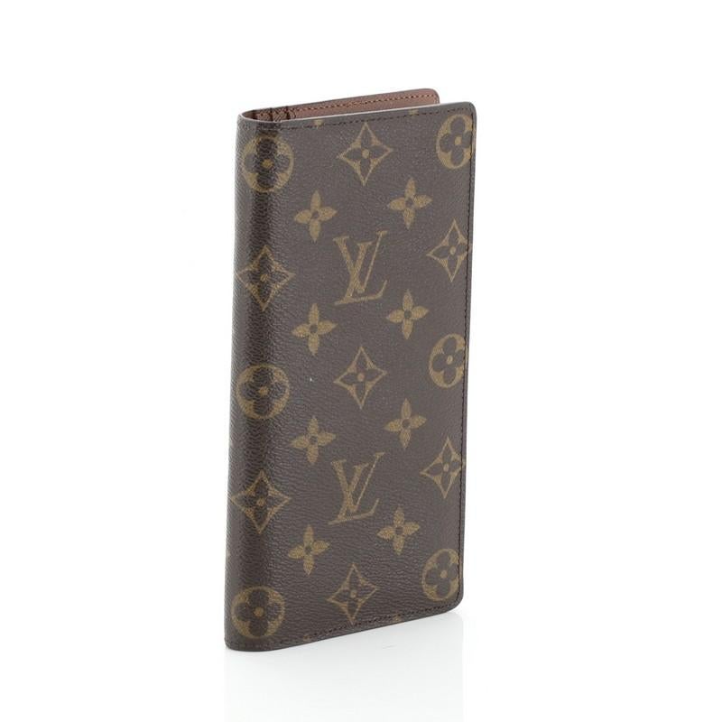 This Louis Vuitton Brazza Wallet Monogram Canvas, crafted in brown monogram coated canvas. It opens to a brown leather interior with multiple card slots and zip and slip pockets. Authenticity code reads: TA1191.

Estimated Retail Price: