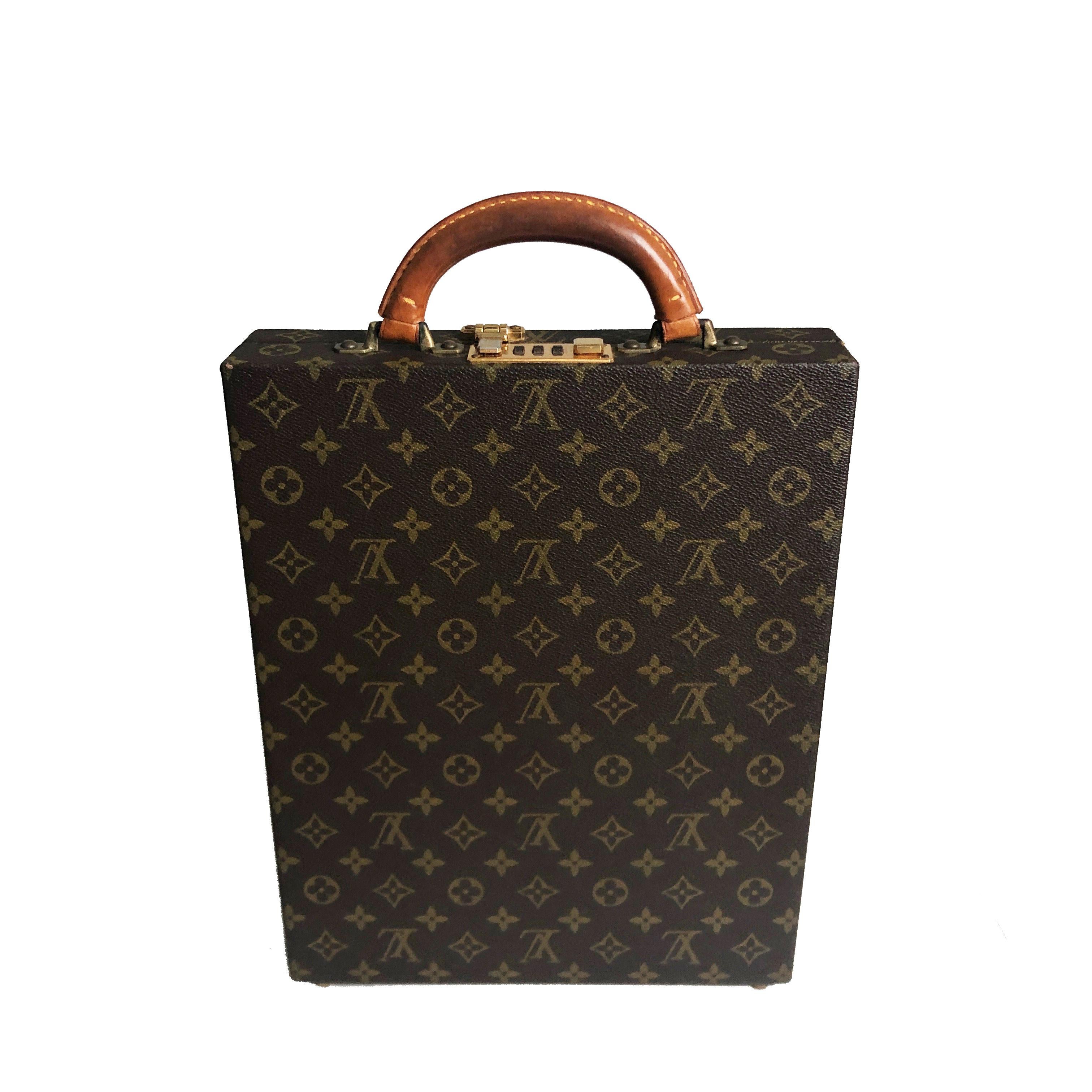 Authentic, preowned vintage Louis Vuitton Hardside Briefcase Monogram Canvas from the 80s.  Lined in leatherette, with organizer section on inner top lid. Comes with its original combination lock instructions.  Preowned/vintage with some signs of