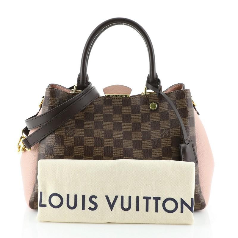 This Louis Vuitton Brittany Handbag Damier, crafted from damier ebene coated canvas and pink leather, features dual rolled handles and gold-tone hardware. Its magnetic snap closure opens to a pink microfiber interior with a center zip compartment.