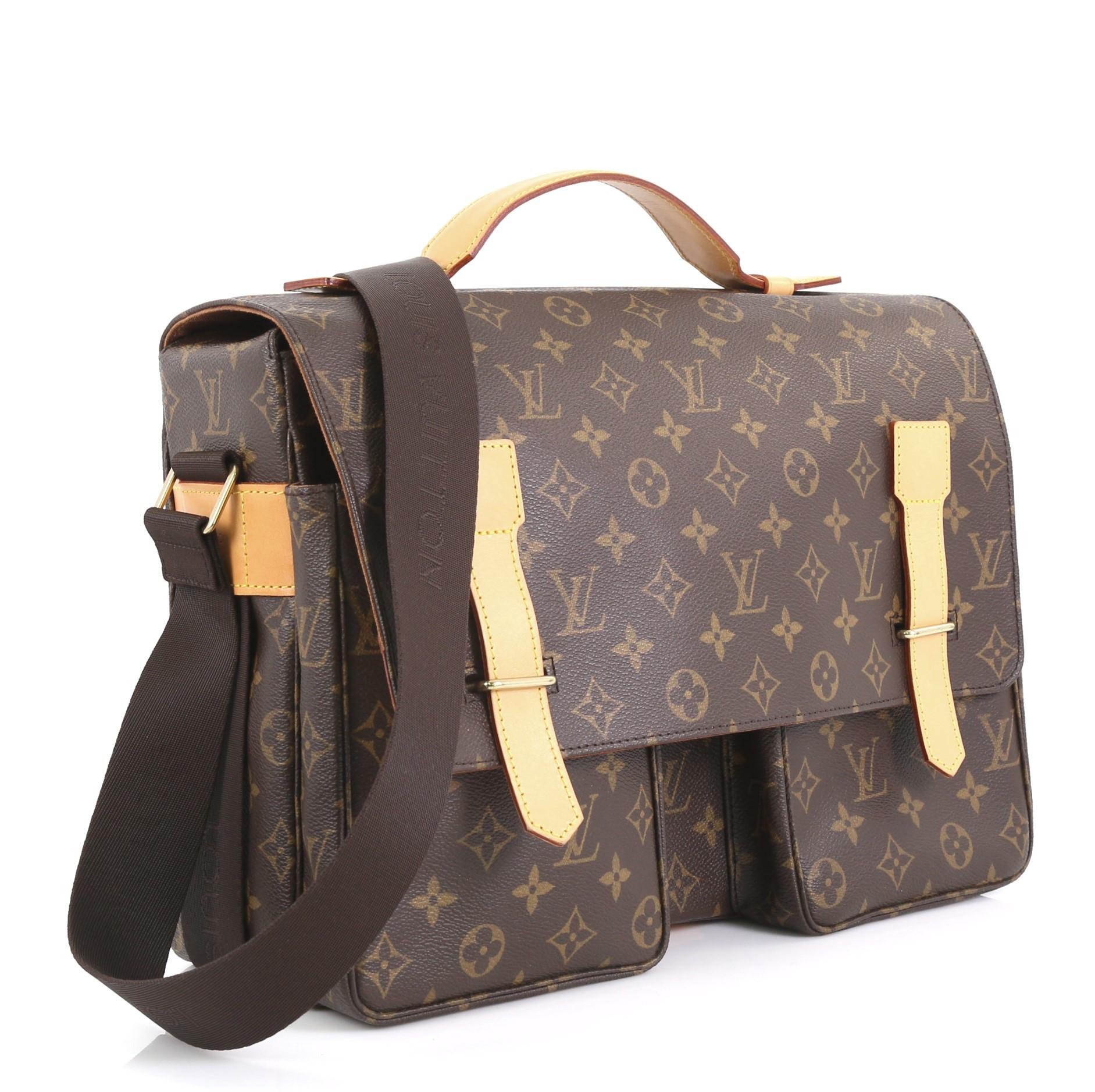 This Louis Vuitton Broadway Bag Monogram Canvas, crafted in brown monogram coated canvas, features an adjustable strap, top handle, two pockets under flap and gold-tone hardware. Its buckle closure opens to a brown canvas interior with slip pockets.