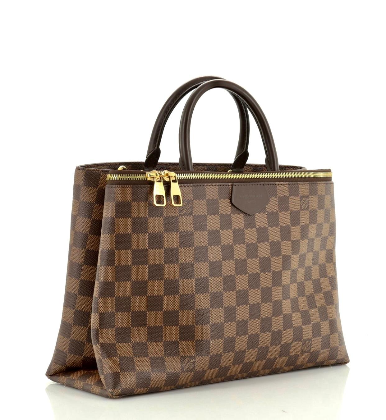 This Louis Vuitton Brompton Handbag Damier, crafted from damier ebene coated canvas, features dual rolled handles, front zip compartment with dual zip closure, and gold-tone hardware. Its hook closure opens to a purple microfiber interior divided