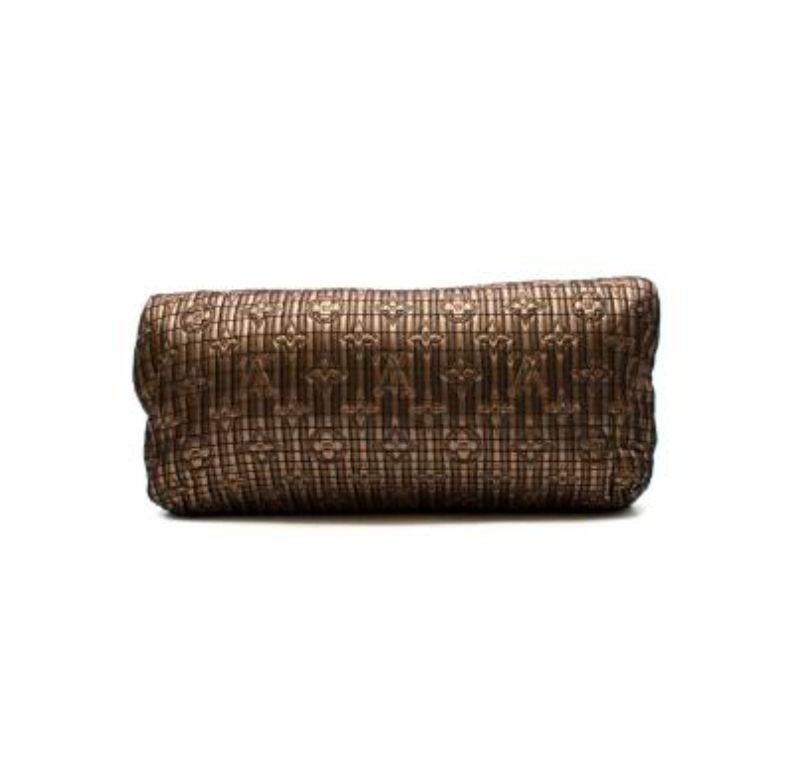 Louis Vuitton Bronze Monogram Quilted Clutch Bag

- Metallic brown and bronze slouchy clutch bag with flap and clasp closure 
- Quilted fabric with embroidered logo monogram 
- Black and gold twist clasp
- Detachable gold metal logo mirror charm
-