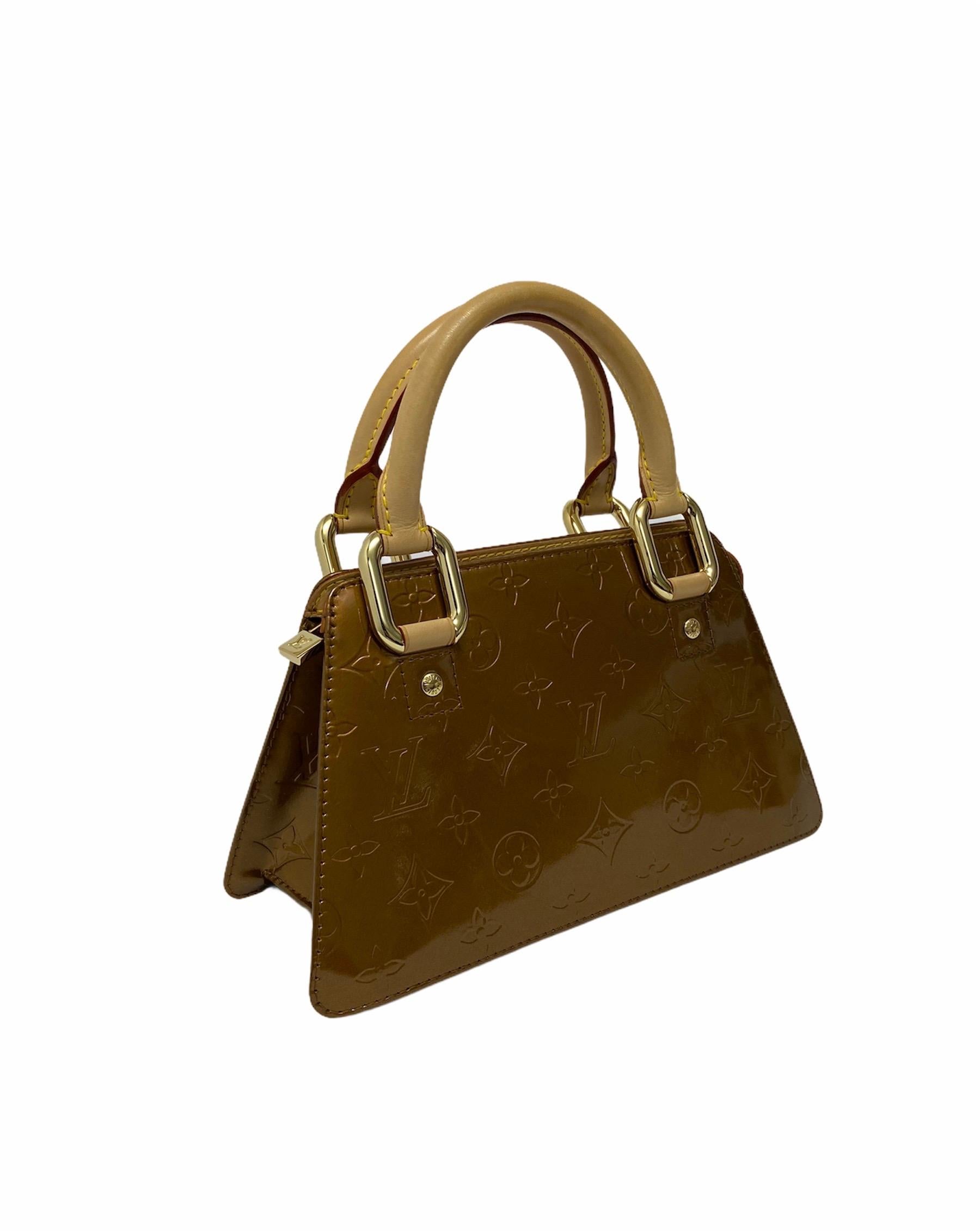 Louis Vuitton bag, Forsyth Mini model, made of bronze patent leather, with cowhide inserts and golden hardware. Equipped with a zip closure, internally lined in brown leather, roomy for the essentials. Equipped with two rigid cowhide handles and an