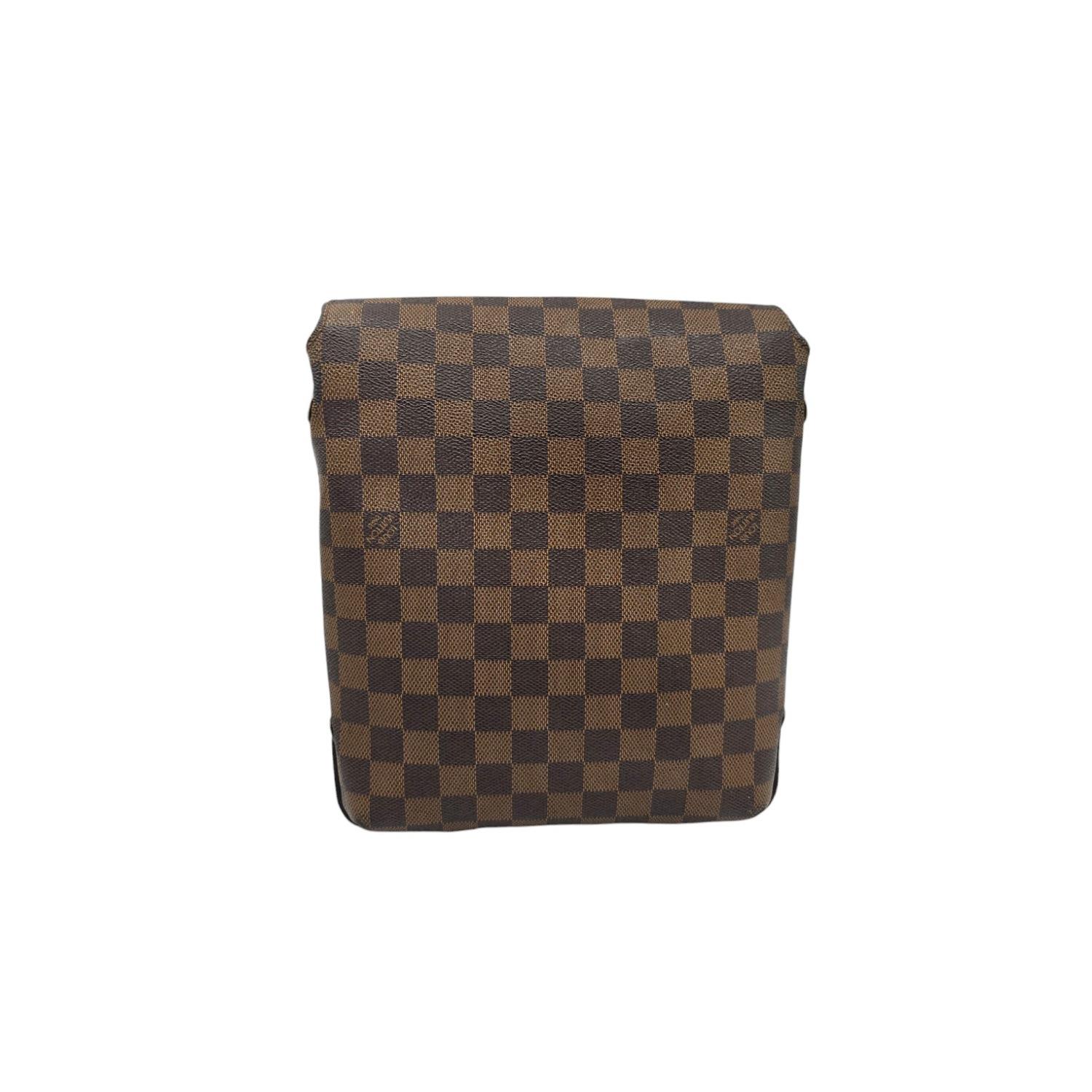 Impeccably designed, this Louis Vuitton Brooklyn Messenger PM showcases the iconic Damier Ebene Canvas pattern with refined brown hardware accents. The versatile crossbody strap adjusts for perfect positioning, while the magnetic flap closure
