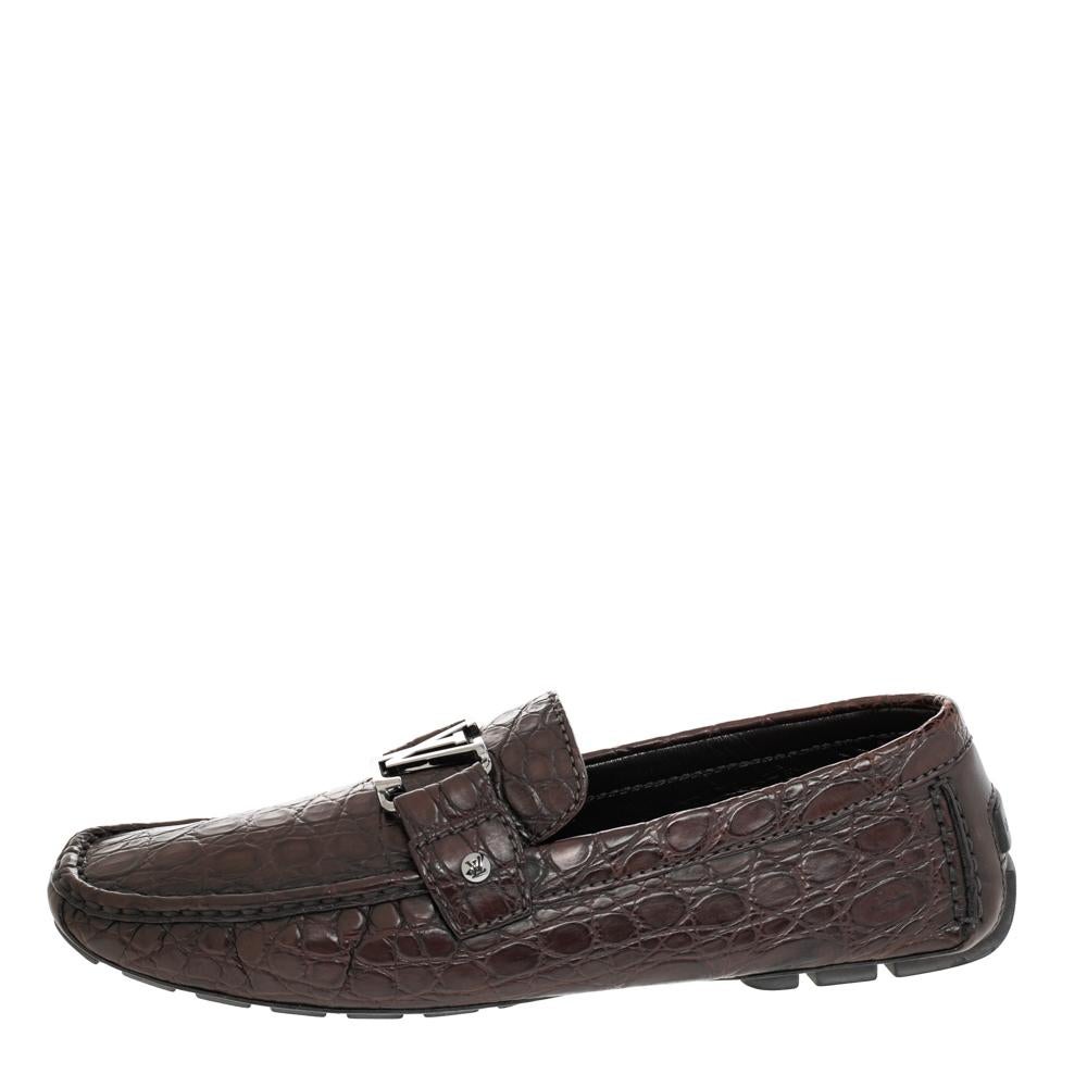 Look sharp and neat with this pair of Monte Carlo loafers from Louis Vuitton. They have been crafted from crocodile leather and designed with the art of fine stitching and the signature LV on the uppers. The pair is complete with comfortable insoles