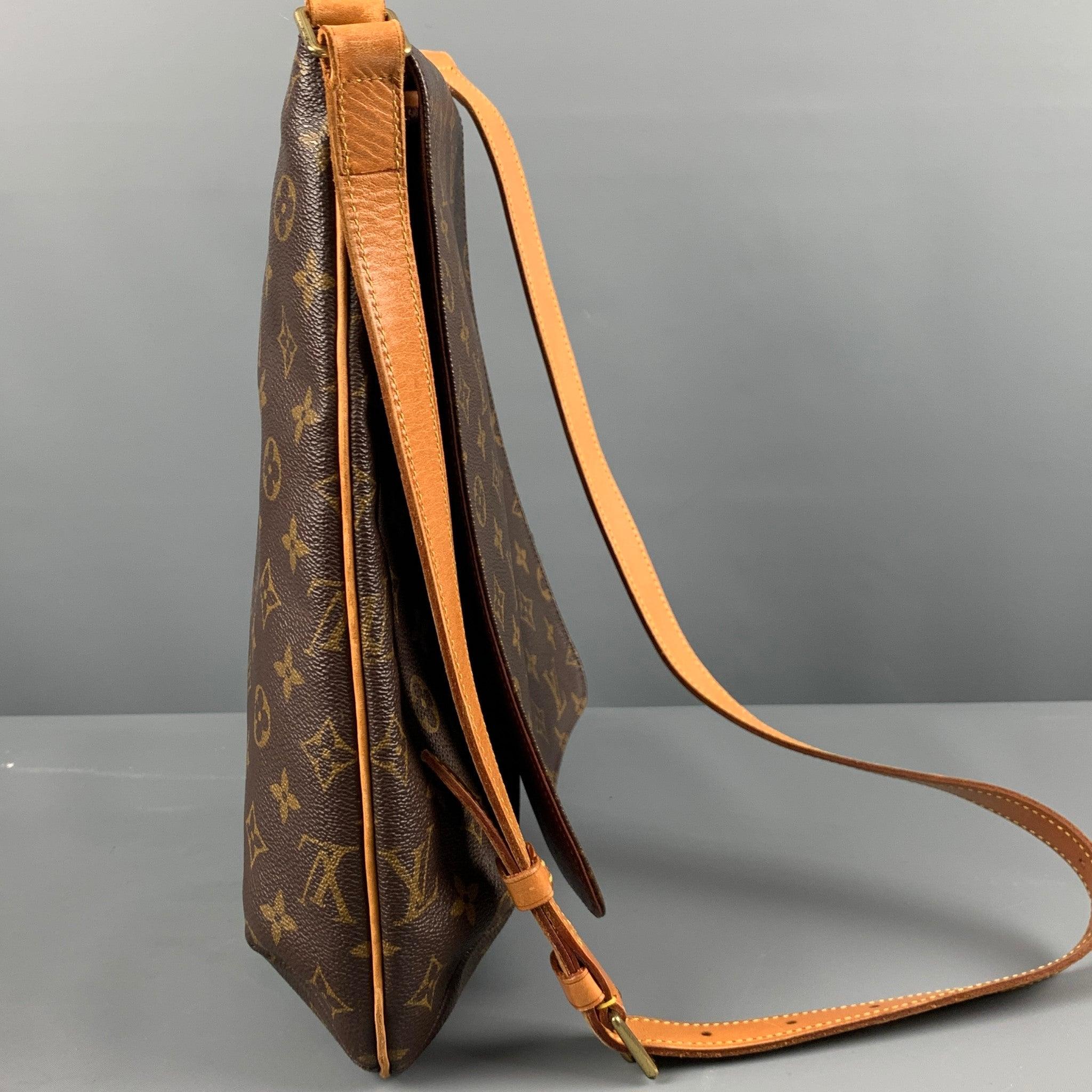 LOUIS VUITTON GM MUSETTE SALSA bag comes in a brown and beige monogram coated canvas featuring a messenger style, adjustable crossbody strap, gold tone hardware, and inner pocket. Made in France. Very Good Pre-Owned Condition. Lights signs of wear.