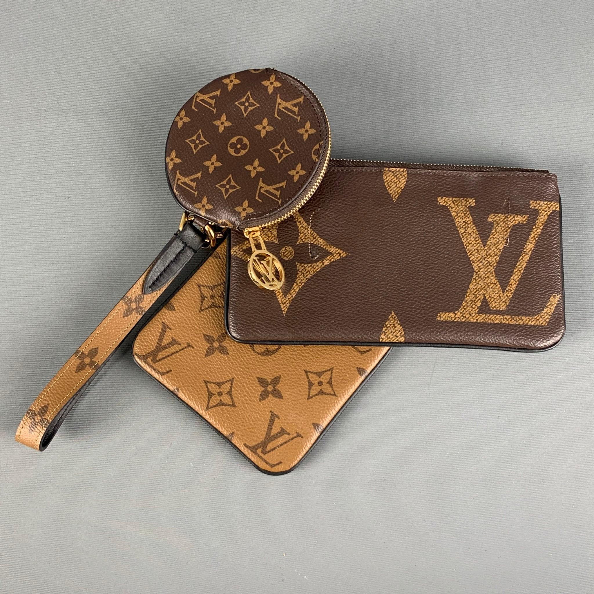 LOUIS VUITTON Trio Pouch Reverse Monogram handbag comes in a brown signature monogram coated canvas leather featuring three different shapes and sizes rectangular, square and round, gold hardware and a wrist strap. Made in France.Very Good Pre-Owned