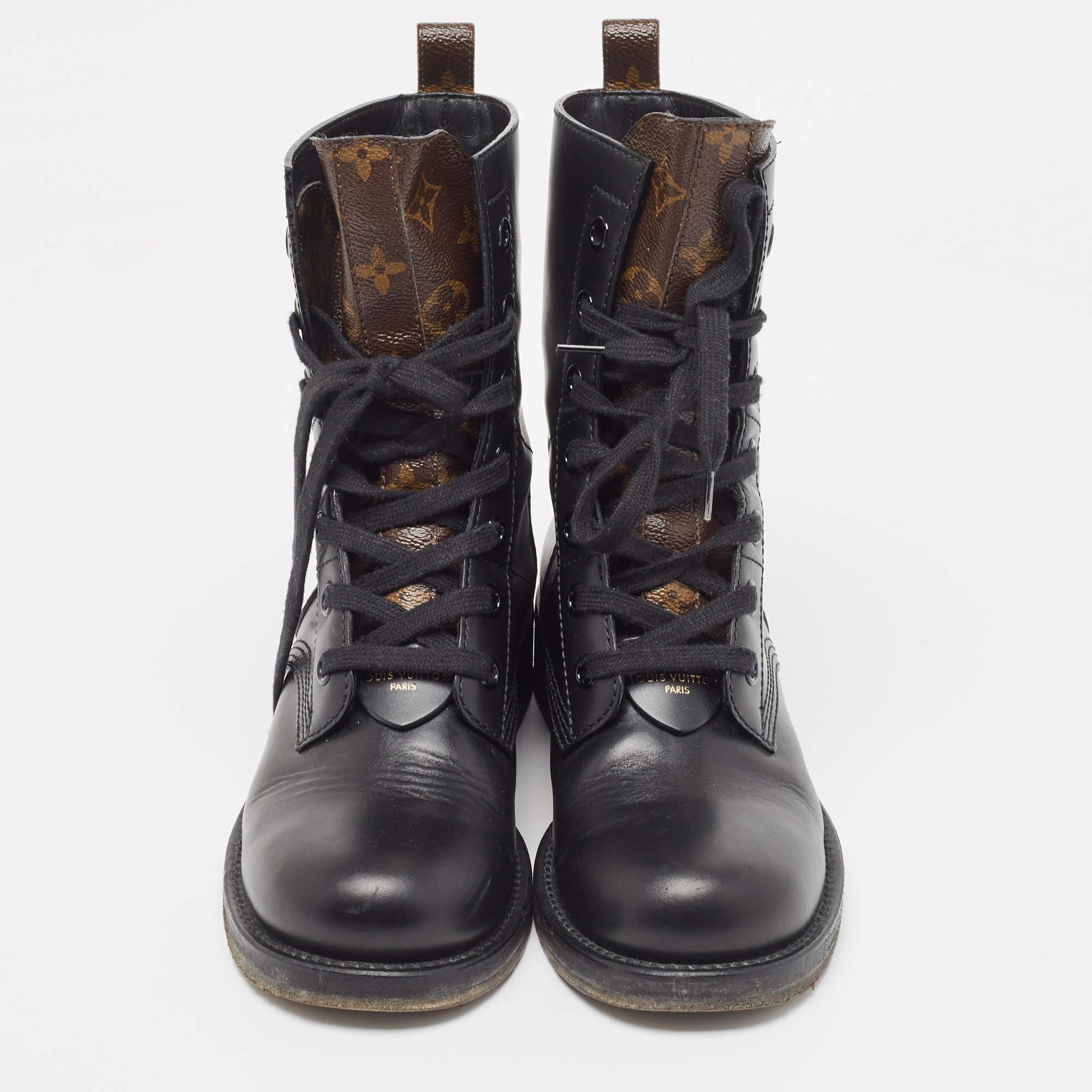 A sleek design amplified by skillful craftsmanship, these Ranger boots from Louis Vuitton assure comfortable fashion. They are sewn using leather and feature Monogram canvas panels, lace-up detailing, and sturdy soles.

Includes: Original Dustbag

