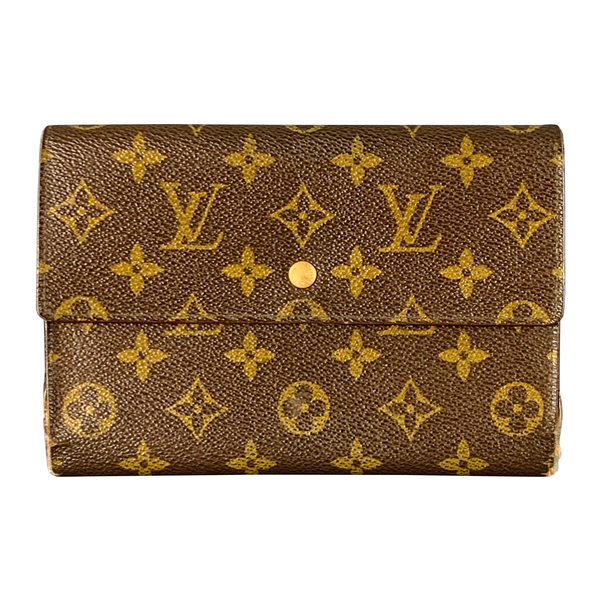 Portafoglio LOUIS VUITTON in tela rivestita con monogrammi in ottone marrone in vendita