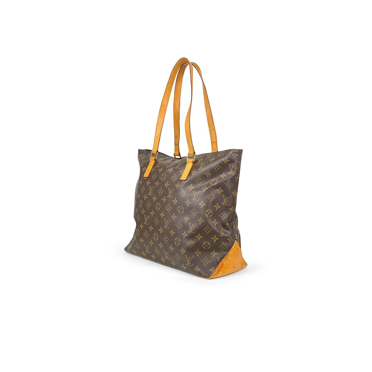 Brown and tan monogram coated canvas Louis Vuitton Cabas Mezzo with

- Brass hardware
- Tan vachetta leather trim
- Dual flat shoulder straps
- Brown canvas lining, single zip pocket at interior wall and zip closure at top

Overall Preloved