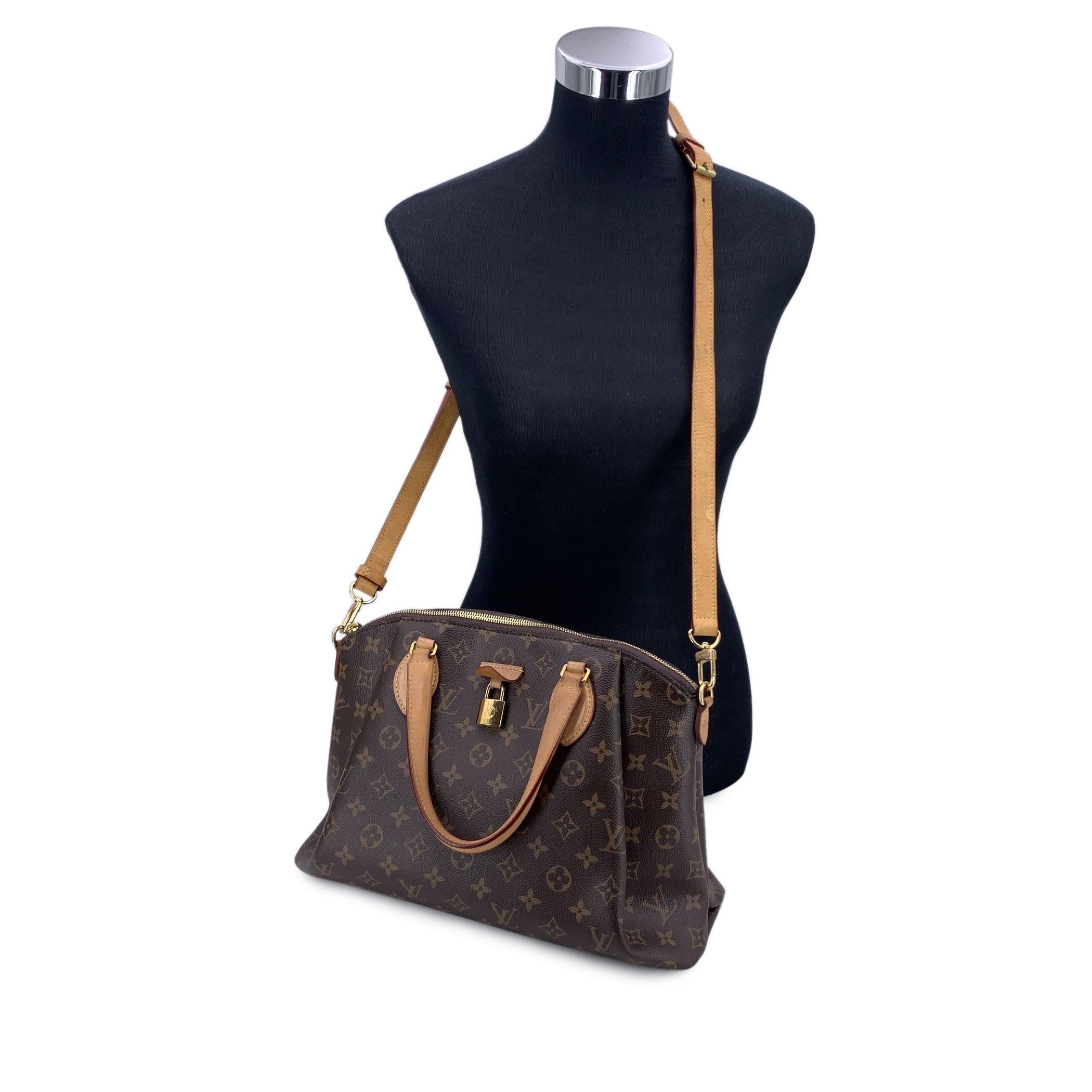 This beautiful Bag will come with a Certificate of Authenticity provided by Entrupy. The certificate will be provided at no further cost Step into the world of timeless luxury with the authentic Louis Vuitton Monogram Rivoli MM, a bag that