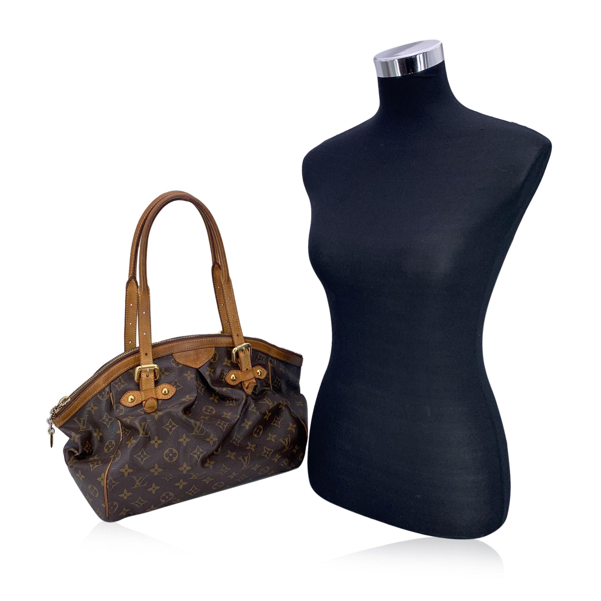 Louis Vuitton Monogram Canvas Tivoli GM Bag. The Tivoli, whose name was inspired by the famous city of Tivoli, Italy, features stylish details such as an inverted pleating and a curved a frame top. Monogram canvas with natural cowhide leather trim.