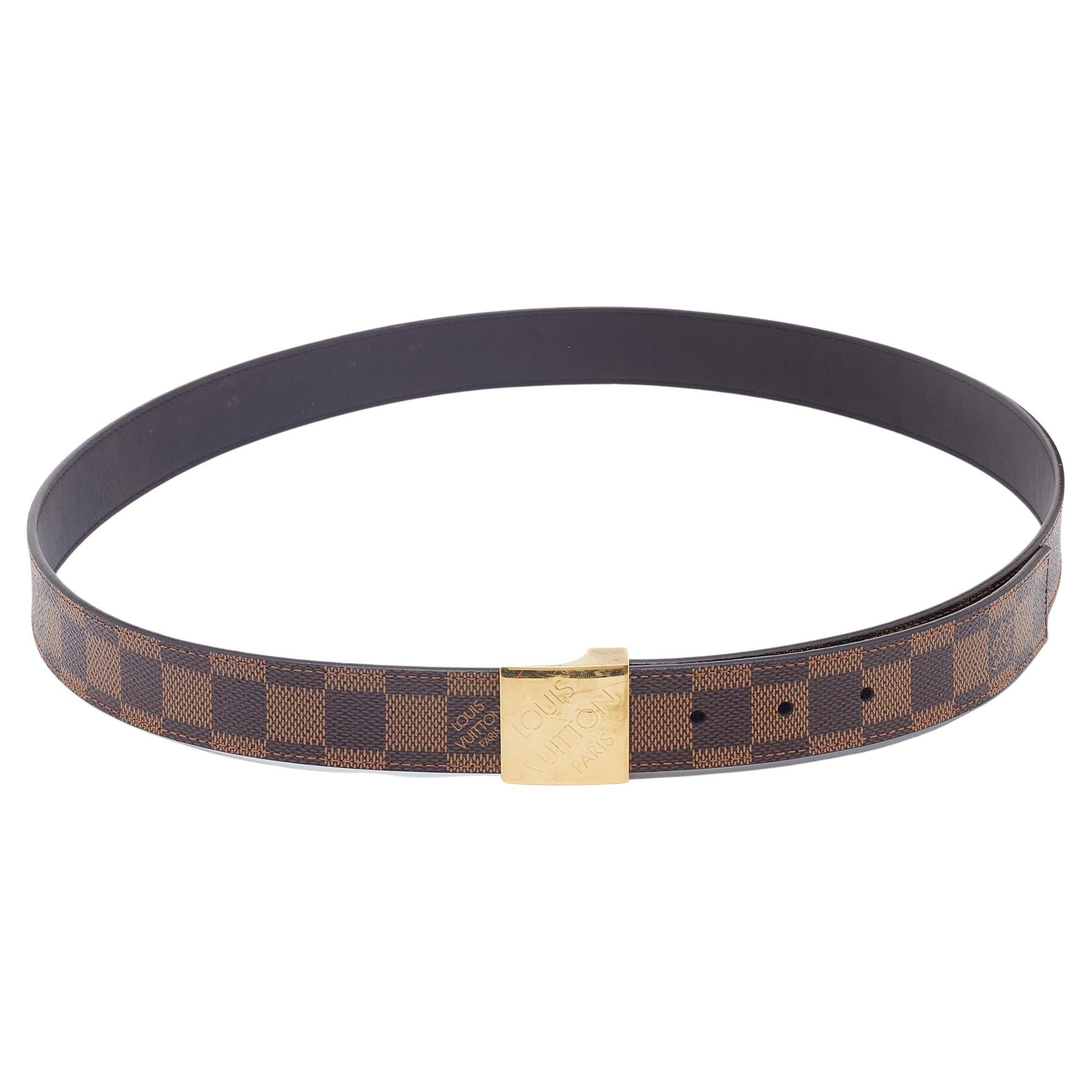 This belt from the House of Louis Vuitton will definitely elevate the look of your attire. It is created using brown coated canvas, with an engraved buckle perched on the front. Elevated with gold-tone hardware, this belt is super sturdy and flaunts