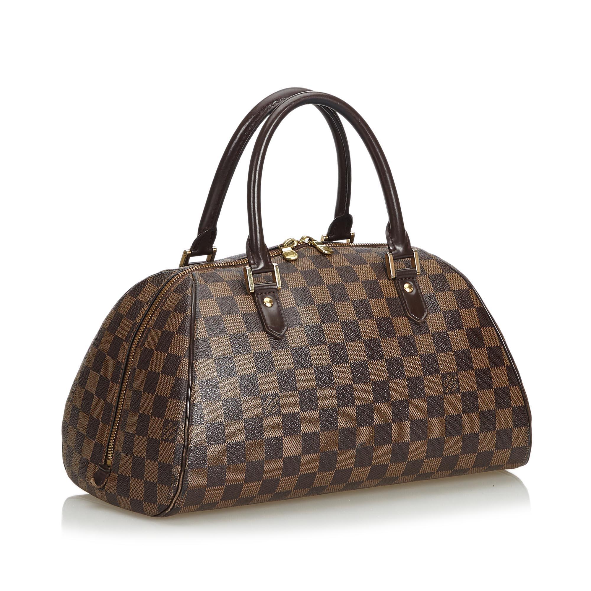 The Ribera MM features a damier ebene canvas body, rolled leather handles, top zip closure, and an interior slip pocket. It carries as B condition rating.

Inclusions: 
Dust Bag


Louis Vuitton pieces do not come with an authenticity card�please