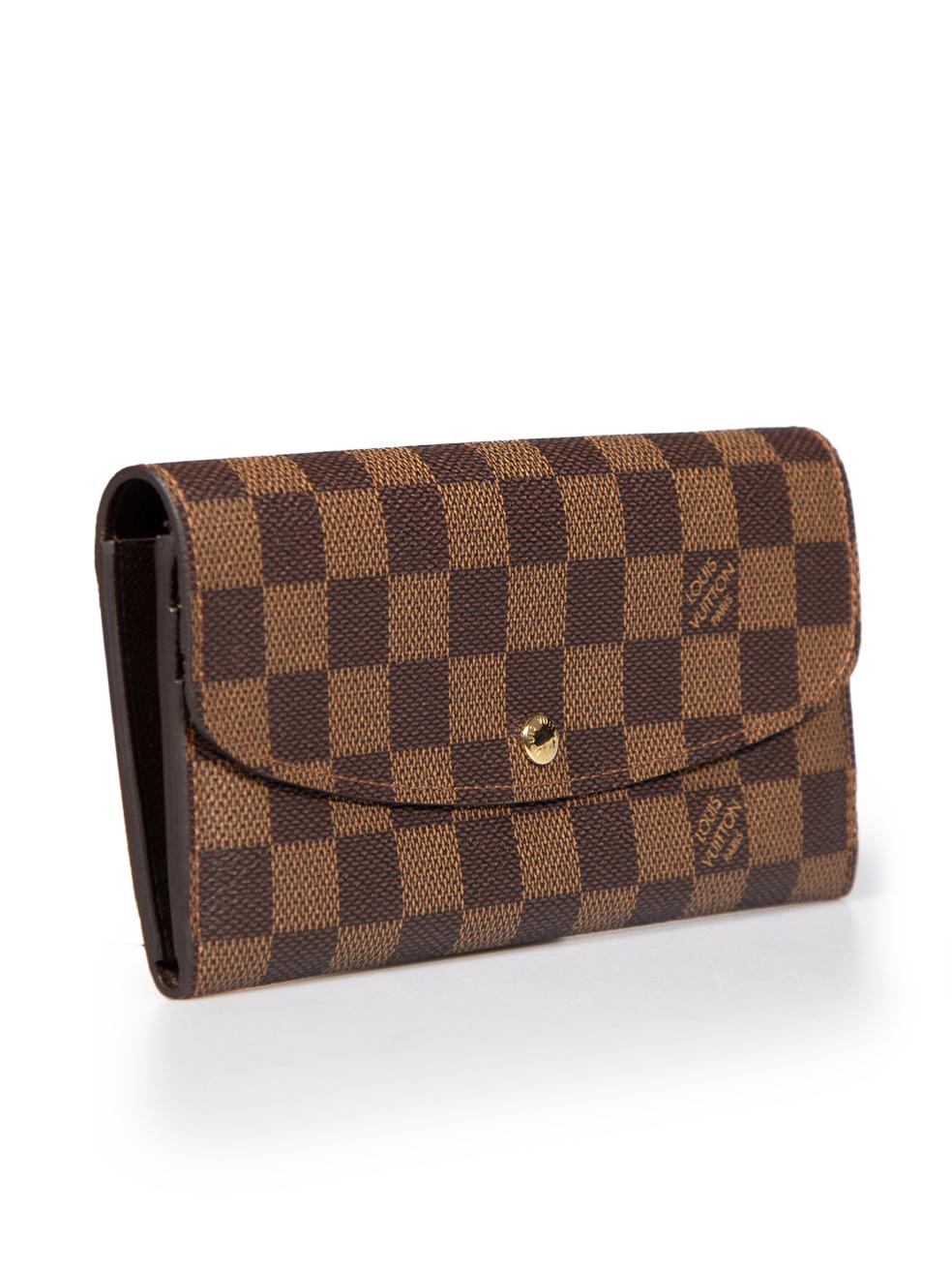 CONDITION is Very good. Hardly any visible wear to the wallet is evident on this used Louis Vuitton designer resale item. This item comes with an original dust bag and box.
 
 
 
 Details
 
 
 Model: Emilie
 
 Brown
 
 Coated canvas
 
 Wallet
 
