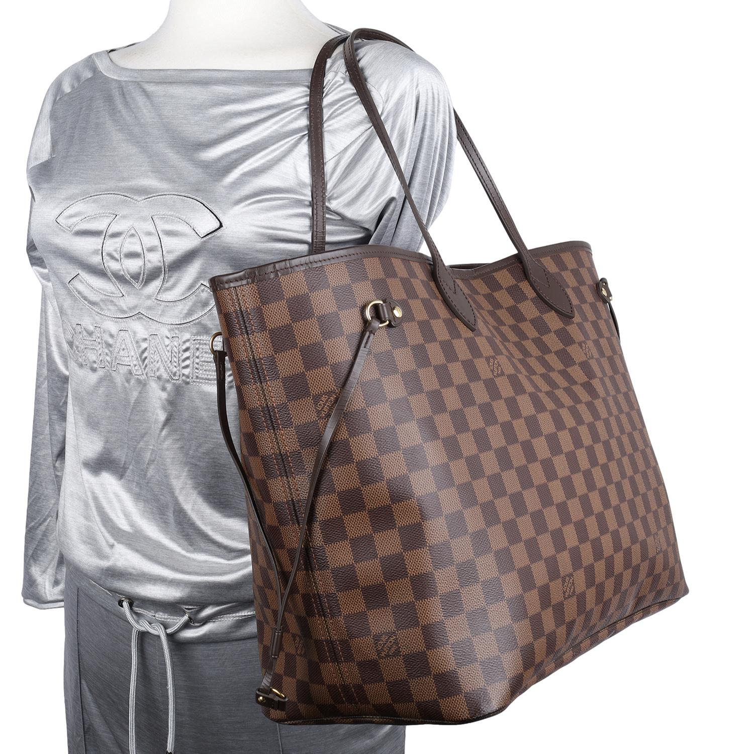 Authentic, pre-loved Louis Vuitton brown Damier Ebene Neverfull GM tote. This stylish tote is crafted of classic Louis Vuitton Damier Ebene brown canvas. Features complimentary leather shoulder straps, trim, side cinch cords, and polished brass
