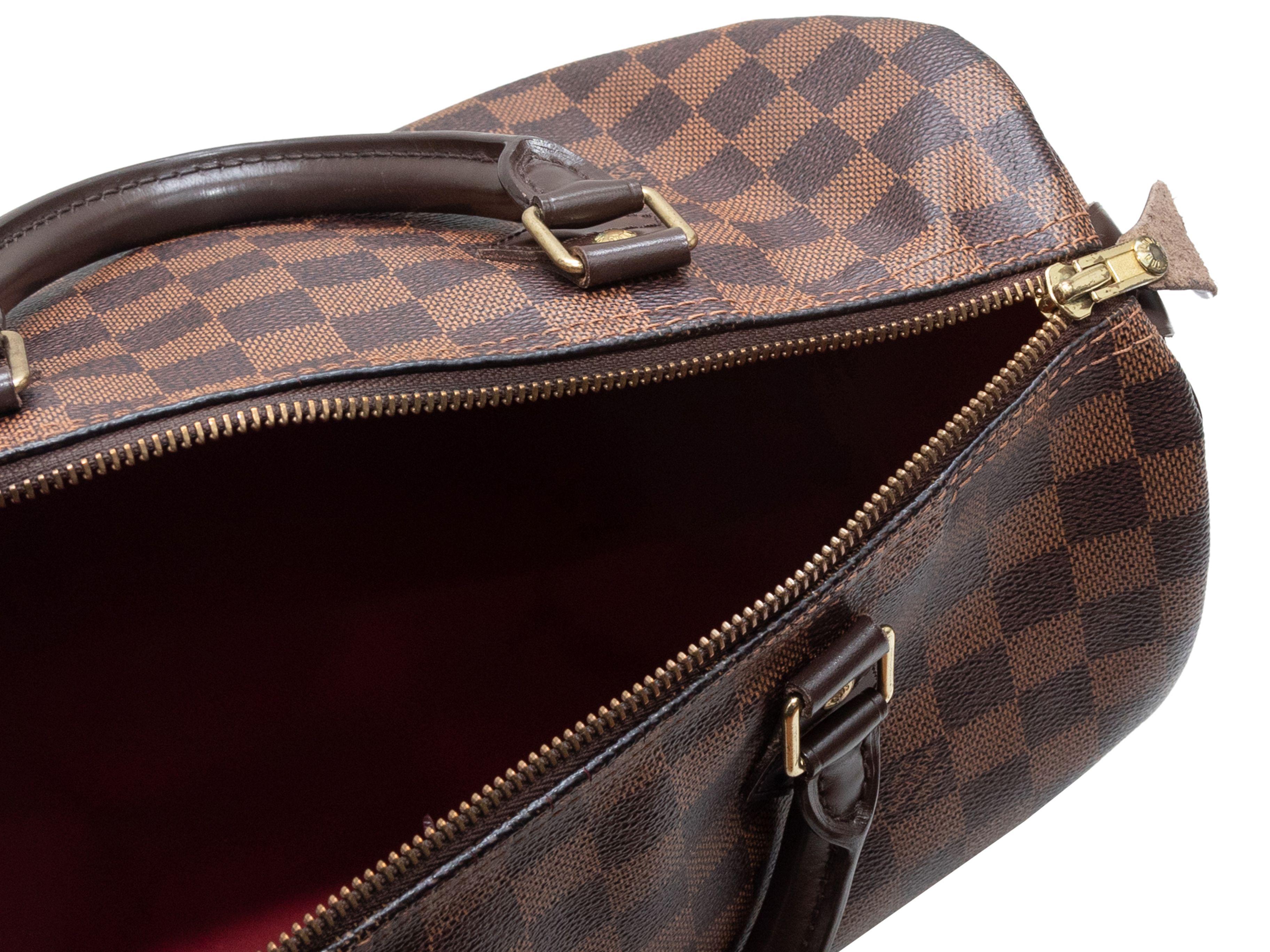 Product Details: Brown Louis Vuitton Damier Ebene Speedy 30 2011 Handbag. The Speedy 30 bag features a coated canvas body, gold-tone hardware, dual rolled top handles, and a top zip closure. 12