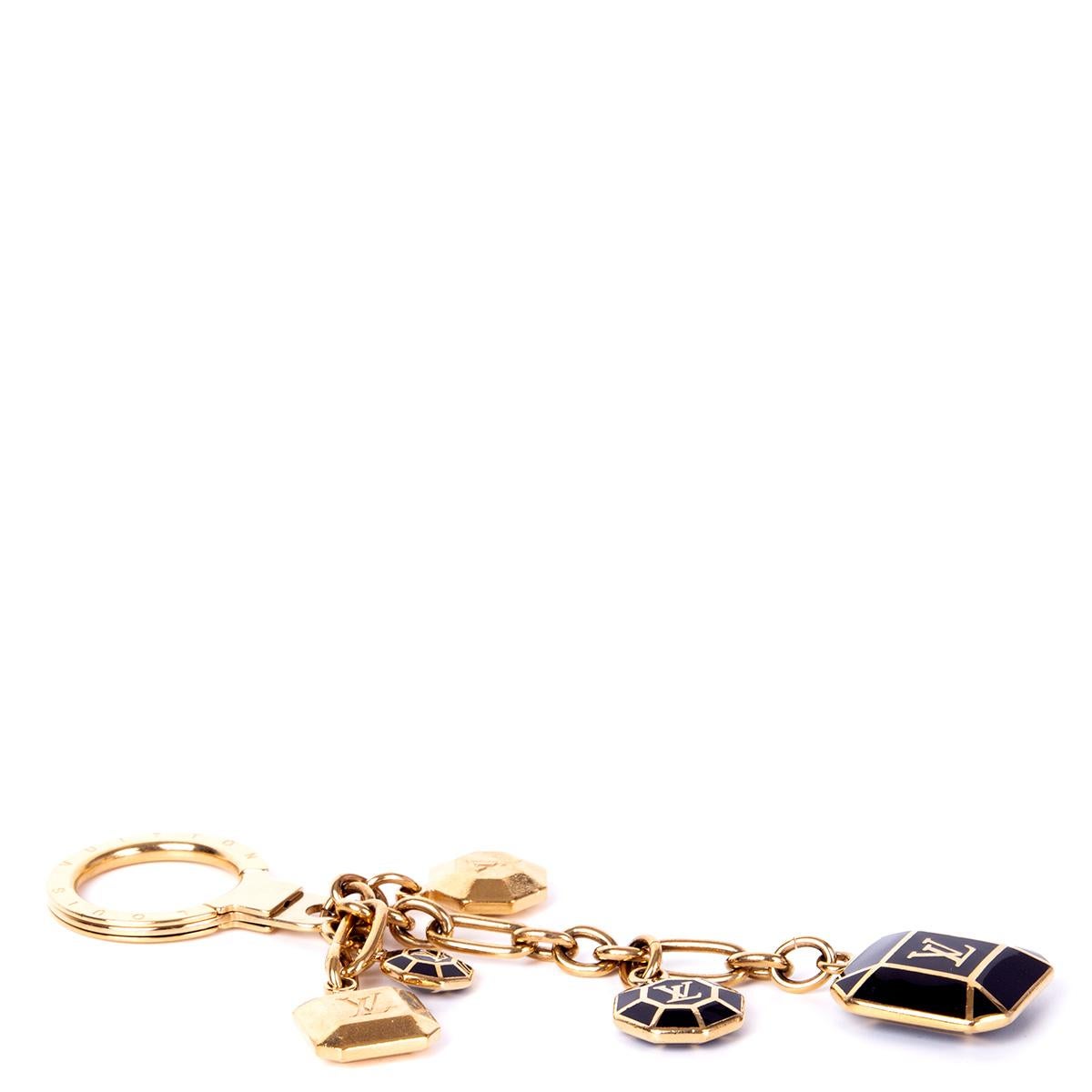 100% authentic Louis Vuitton diamond shaped keyring in gold-tone brass and brown enamel. Has been carried and is in excellent condition. 

Measurements
Width	2.5cm (1in)
Height	13cm (5.1in)
Hardware	Gold-Tone

All our listings include only the