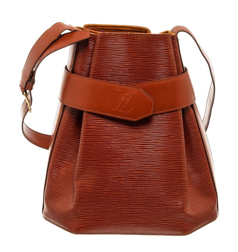 Louis Vuitton Brown Epi Leather Sac D'epaule with an adjustable shoulder strap, gold tone hardware, snap closure and suede lining.

75008MSC