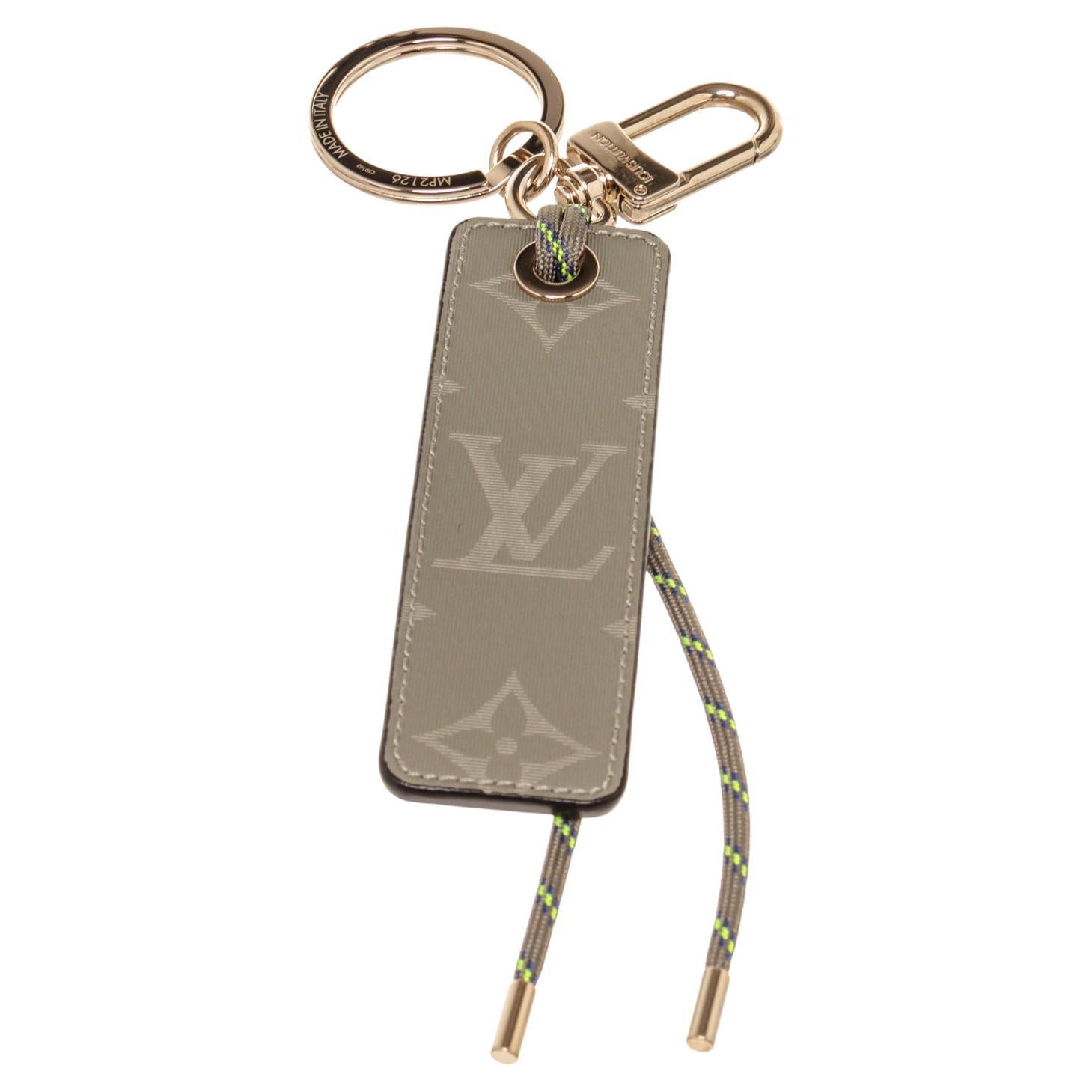 Louis Vuitton Brown Fluo Tab Bag Charm with gold-tone hardware.  For Sale