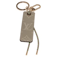 Louis Vuitton Brown Fluo Tab Bag Charm with gold-tone hardware. 
