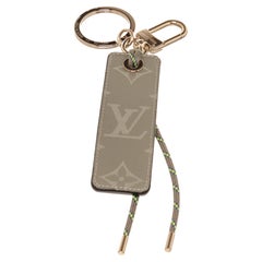 Louis Vuitton Brown Fluo Tab Bag Charm with gold-tone hardware.