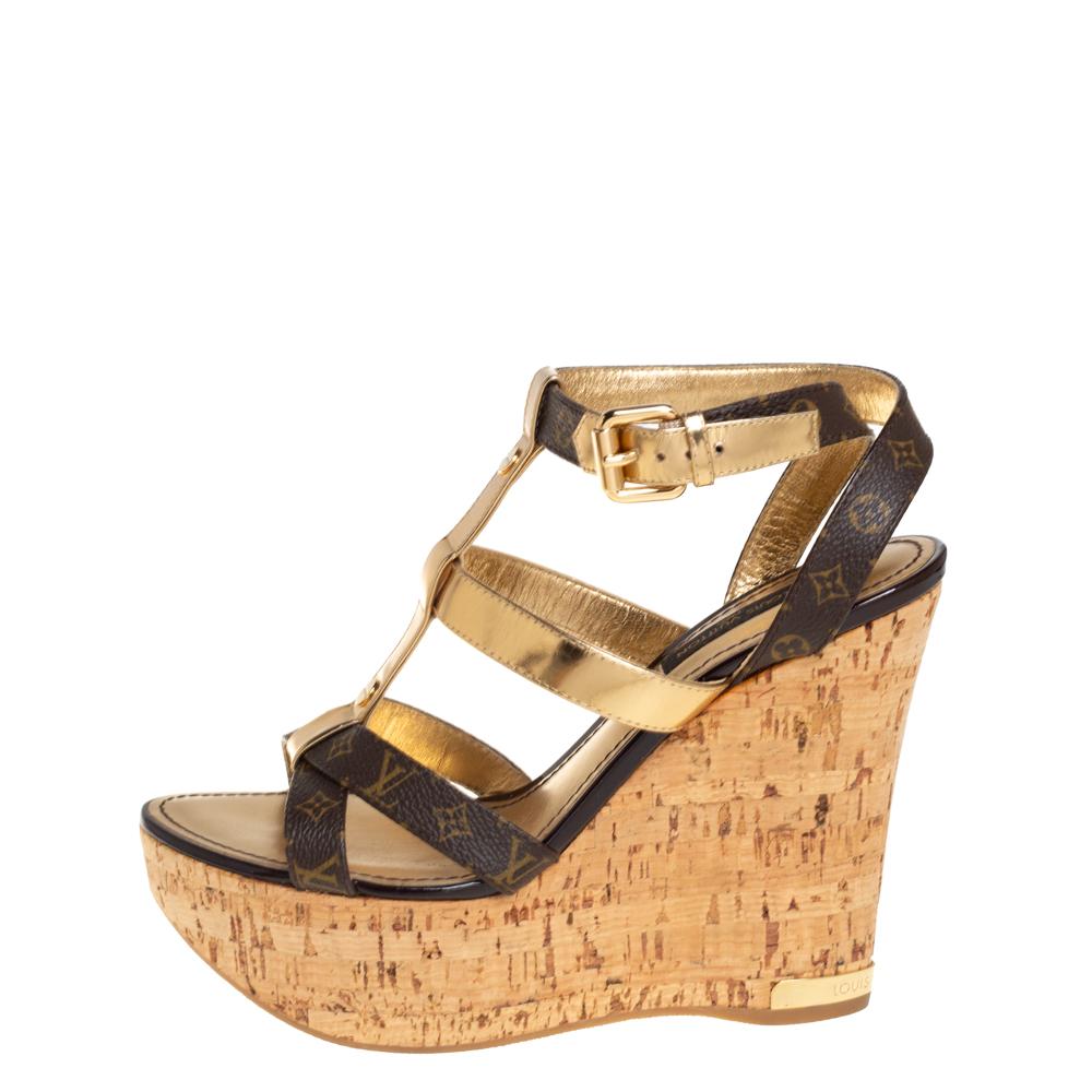 A perfect blend of comfort and style, these leather & monogram canvas sandals are just what you need for an evening out. The strappy design adds style to your basic pair of sandals. This pair from Louis Vuitton comes with platforms and high wedge