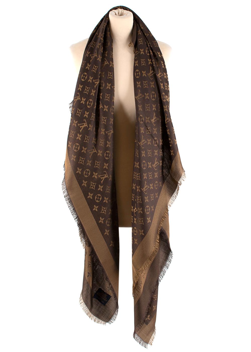 Louis Vuitton Brown & Gold Monogram Shine Shawl

This sophisticated shawl, woven with a tone-on-tone Monogram pattern, is given a subtle shimmer by the use of a soft shine yarn.

-Iconic monogram pattern
-Gorgeous, classic brown hue with a gold