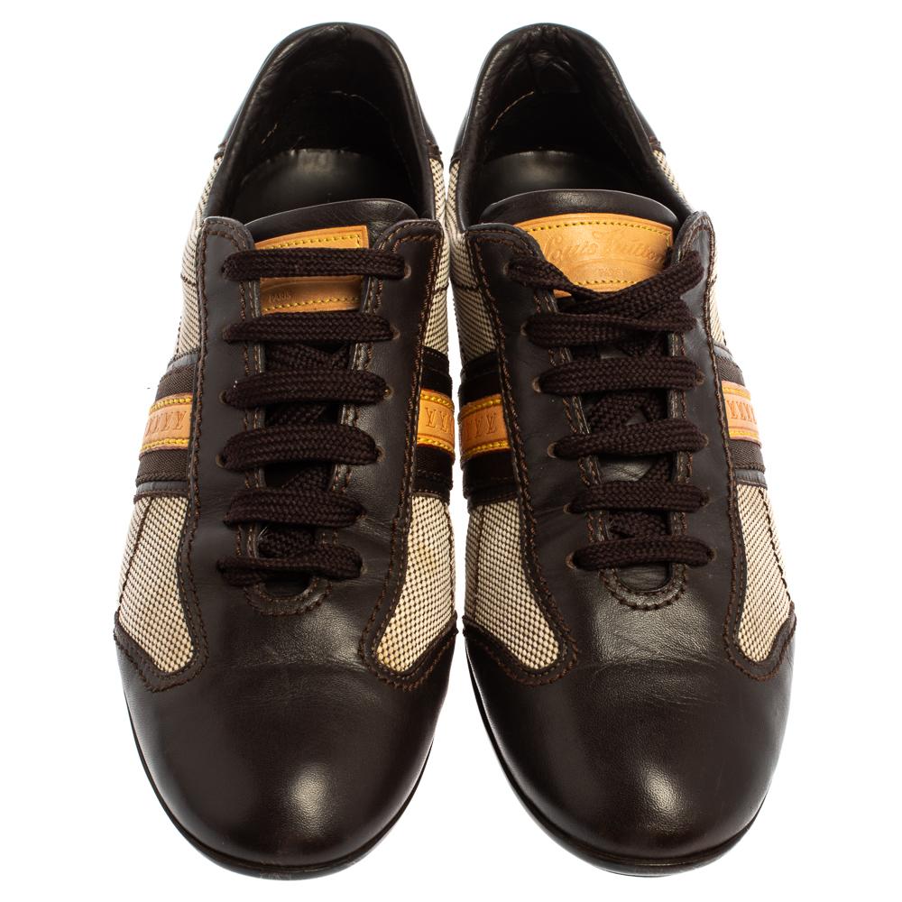 Sleek and smart, these sneakers by Louis Vuitton will charm everyone that lays eyes on them. Crafted from leather and canvas, they have a low-top silhouette. They come with lace-ups, logo bands on the sides, LV logo detailing at the heels and rubber