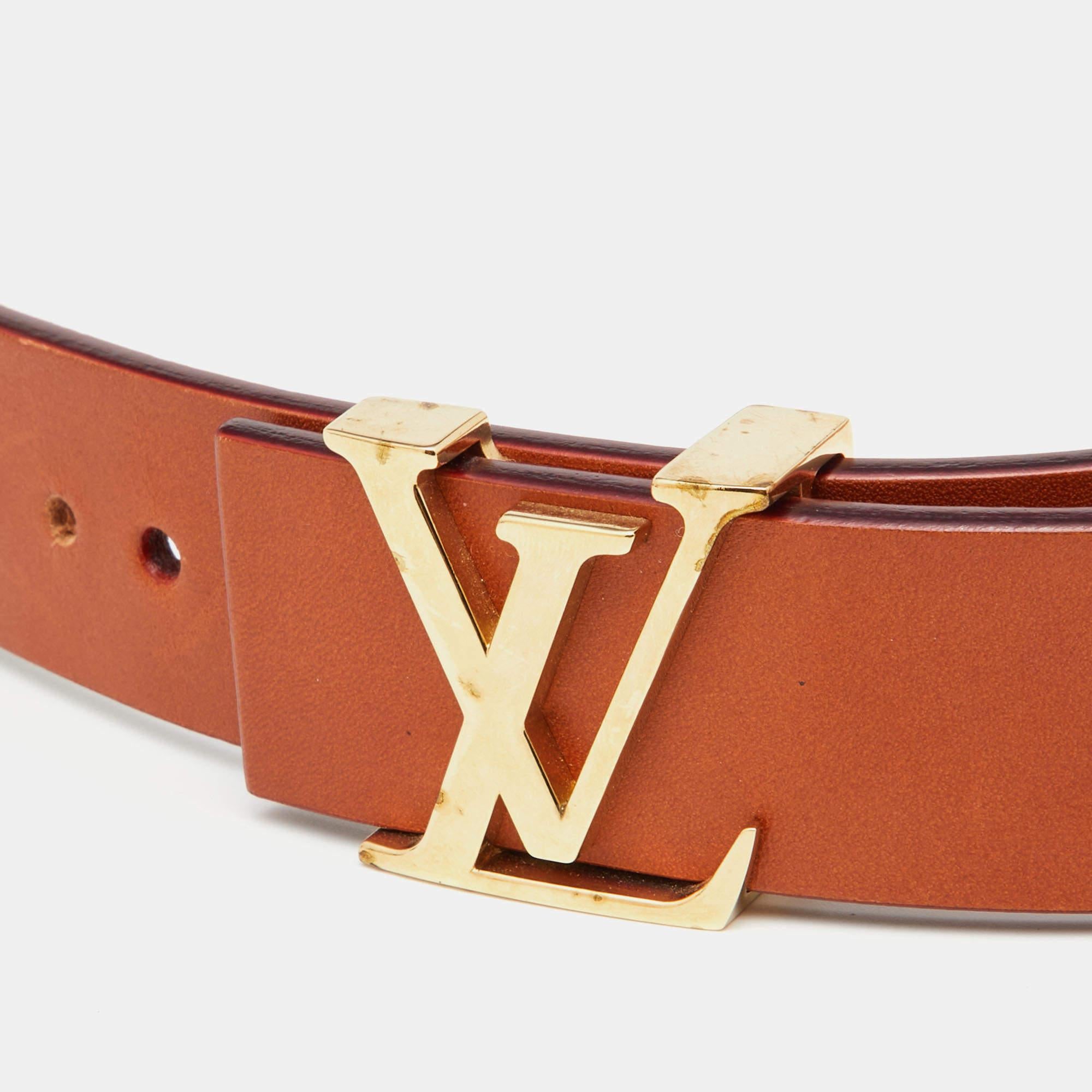 This Initiales belt from Louis Vuitton is simple in design but nevertheless quite appealing. The leather belt has gold-tone hardware in the form of the enlarged iconic LV symbol and the brand name is also engraved on the backside.

Includes: