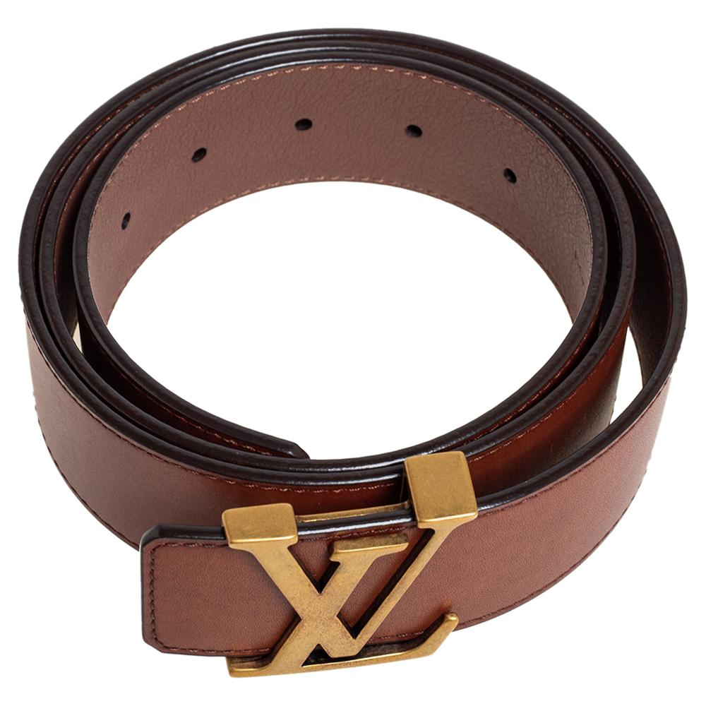 This Initiales belt from Louis Vuitton is simple in design but nevertheless quite appealing. The leather belt has gold-tone hardware in the form of the enlarged iconic LV symbol and the brand name is also engraved on the backside.

Includes: