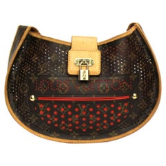 Louis Vuitton - Sac en cuir brun perforé