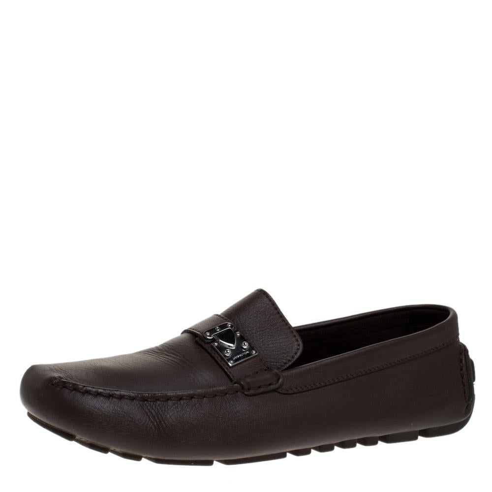 This pair of Louis Vuitton's Driving loafers combine comfort with style. Crafted from brown Suhali leather, they feature comfortable insoles and the signature S lock on the uppers. This pair can be teamed up with your casual attire. They are