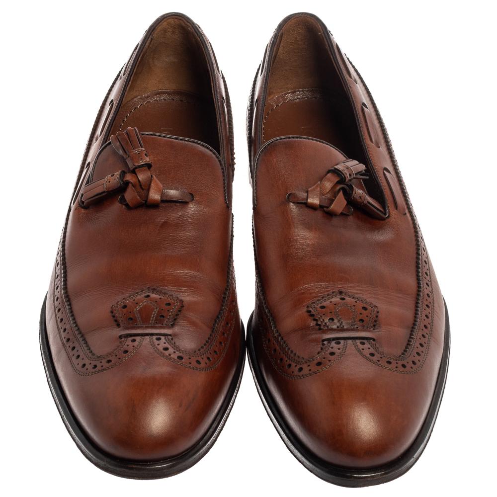 These stylish loafers from Louis Vuitton are just what you need to highlight a smart look. These impressive brown shoes can add a twist to your entire outfit on any occasion. They are crafted from leather and beautified with brogue detailing and
