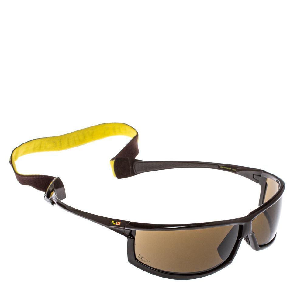 These cool sunglasses by Louis Vuitton are designed for sports and excursions. The creation is made from acetate as well as rubber and the well-shaped design is held by an elastic strap that has the brand name. The brown pair is a must-have and will