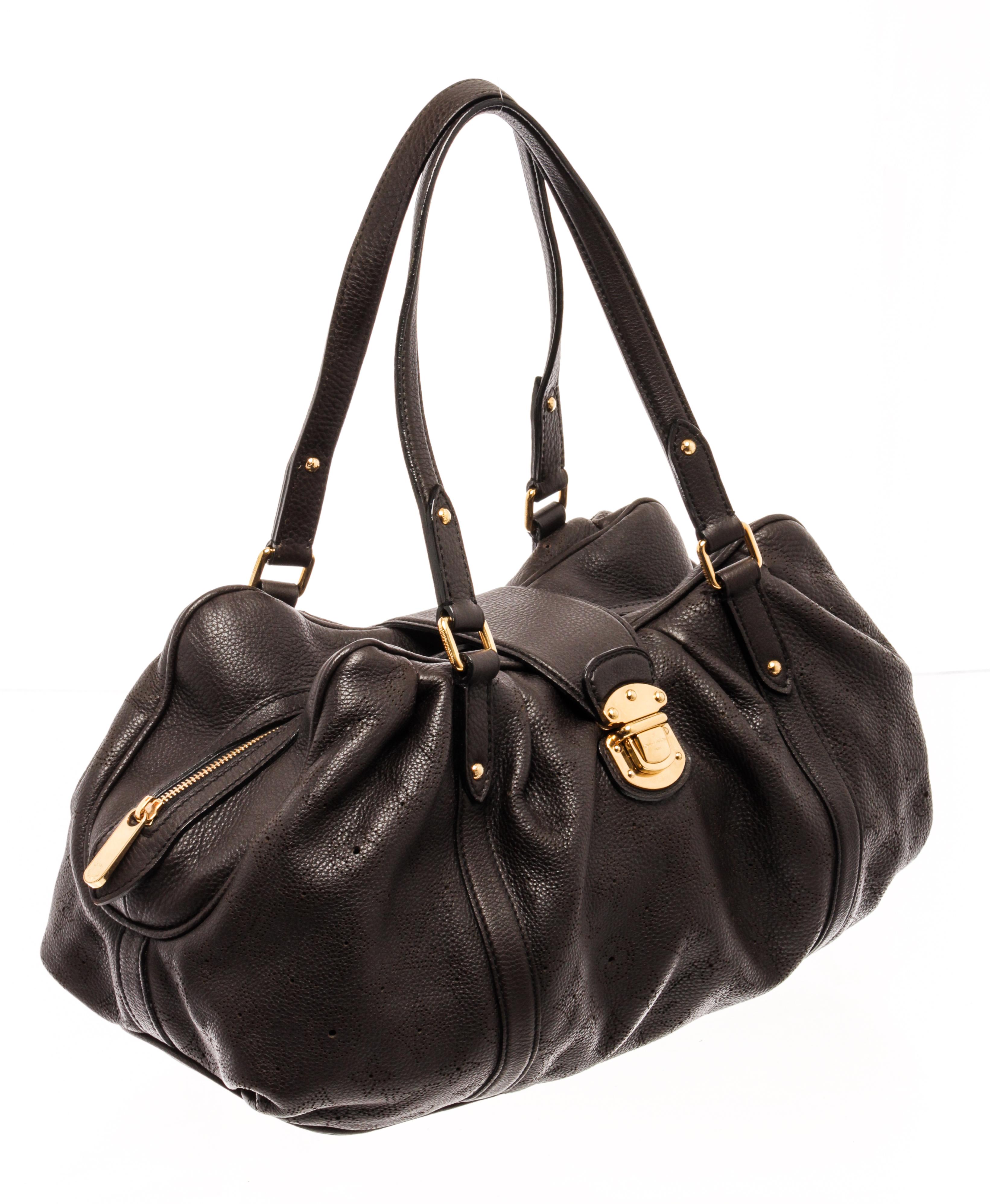 Louis Vuitton Brown Mahina Leather Lunar GM Hobo Bag with the bag has two thin rolled leather handles, a focal point is the central polished brass clasp closure that opens to a dark brown microfiber interior with zipper and patch pockets.

59177MSC
