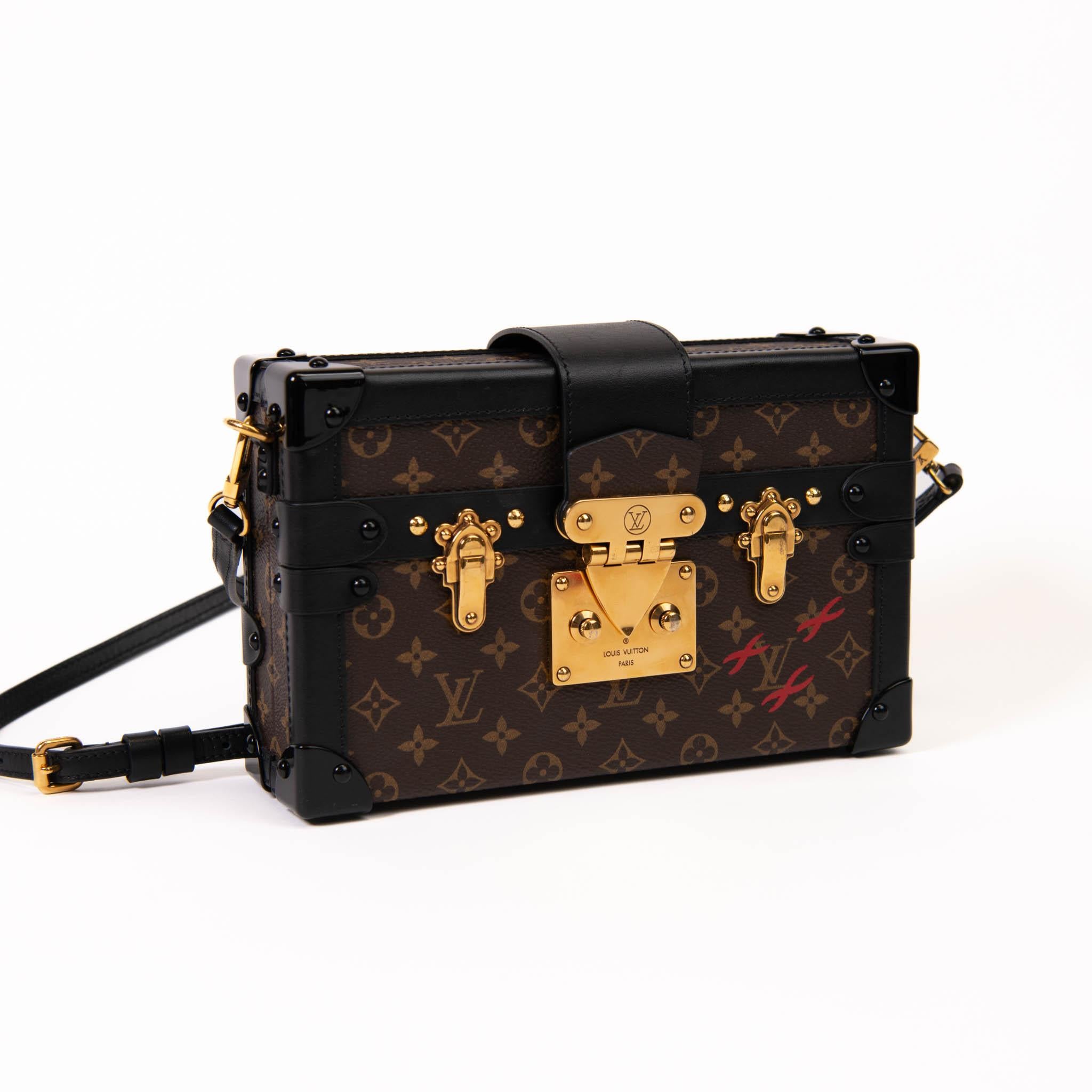 100% Authentic

This stylish trunk bag is crafted of Louis Vuitton monogram on toile canvas. The shoulder bag features an optional, adjustable black leather shoulder strap, matching leather trim, and polished black hardware at the joints with