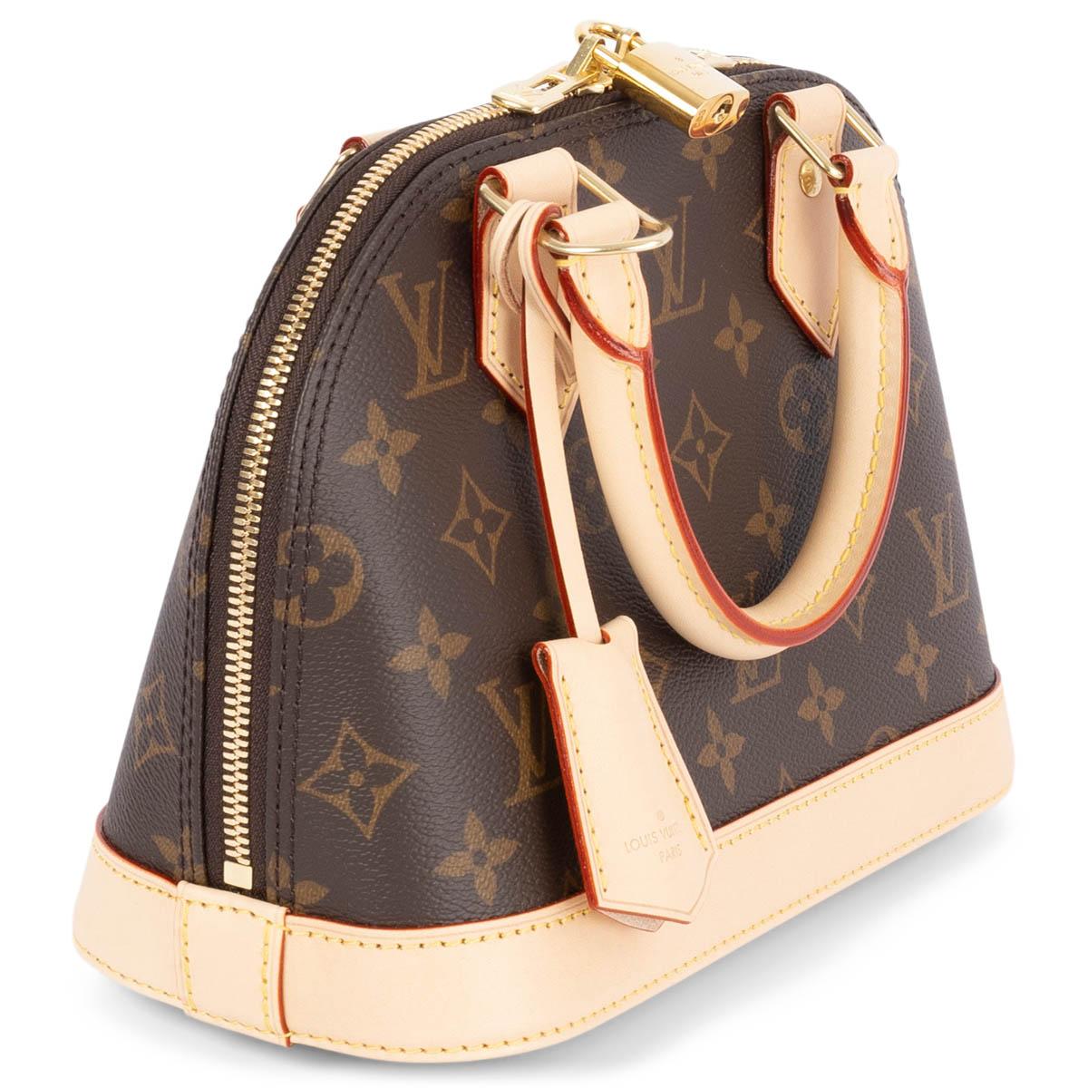 100% authentic Louis Vuitton Alma BB Monogram Bag in brown coated canvas featuring smooth cowhide-leather trim and gold-tone hardware. Lined in brown canvas with one flat pocket against the back. Opens with a double zip closure and comes with