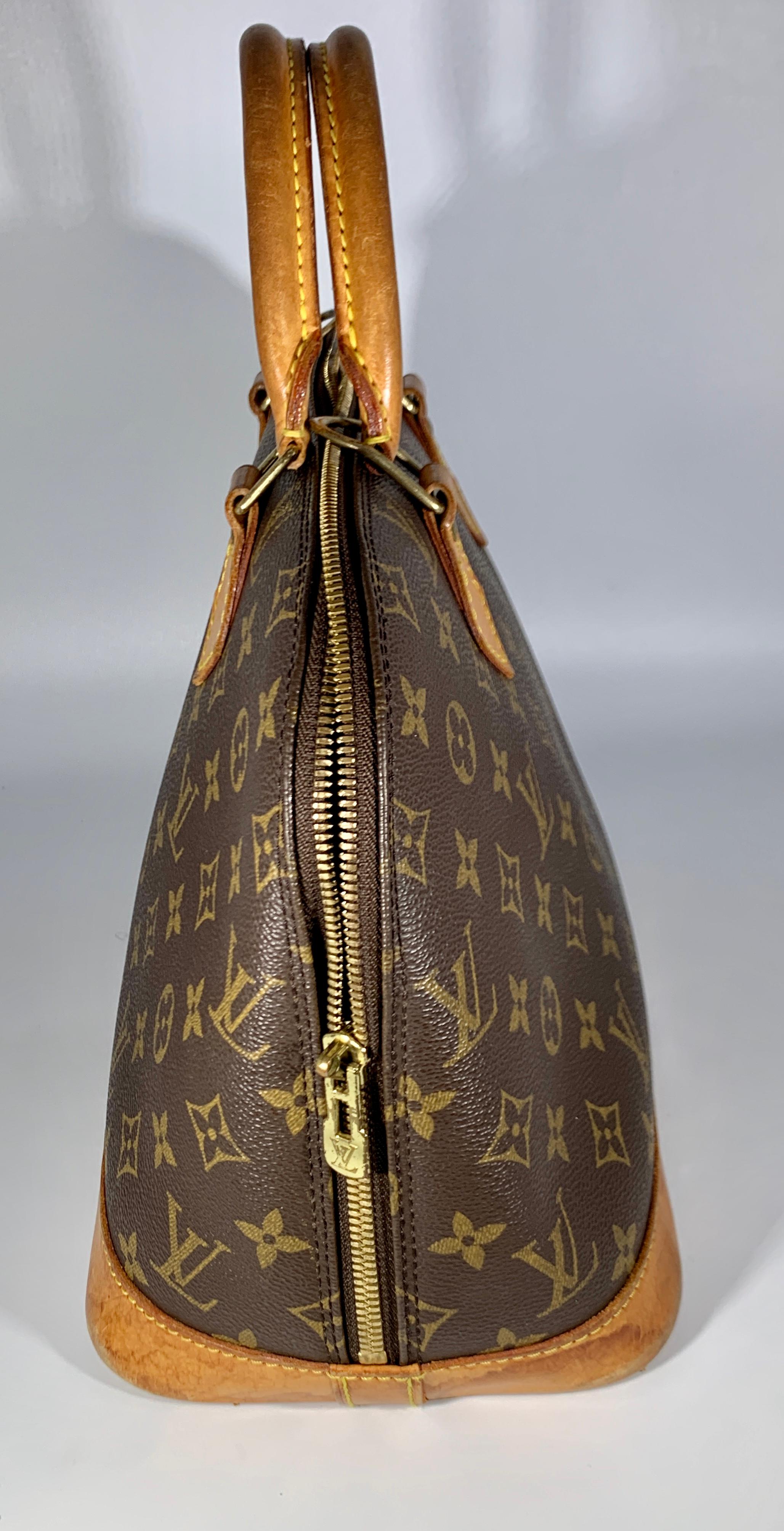 A Louis Vuitton logo-printed Louis Vuitton Speedy 30 with leather trim with bring a touch of heritage luxury wherever you carry it.
We guarantee this is an authentic LOUIS VUITTON Monogram Alma PM or 100% of your money back. This bowling-style