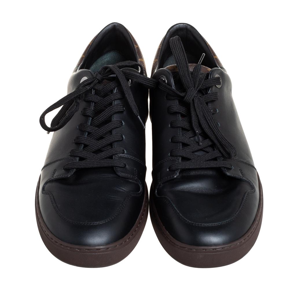 Minimal yet stylish, these low-top sneakers from Louis Vuitton are worthy of being worn by you! They have been crafted from the signature monogram canvas and black leather and styled with round toes and lace-ups on the vamps. They are complete with