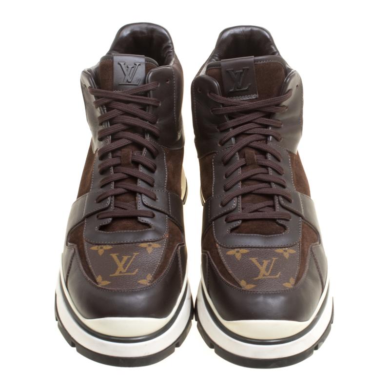 These Louis Vuitton sneakers are trendy and stylish. Richly crafted from Monogram canvas, leather and detailed with suede and fabric patches as well as laces, they are sure to make a dream buy. The high-top sneakers also have platforms and