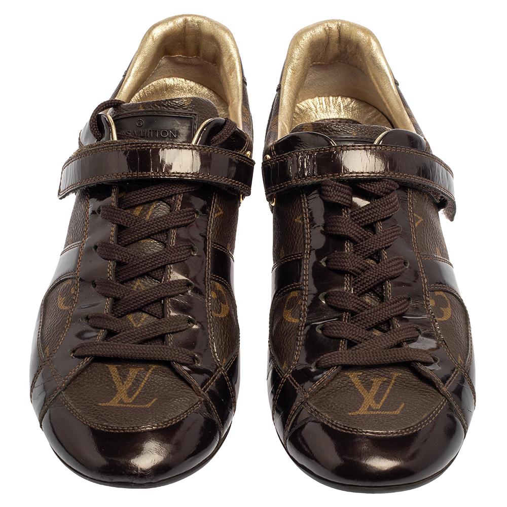 These stylish Louis Vuitton sneakers are designed to deliver signature looks every time. Crafted from monogram canvas and patent leather, they come in a grand shade of brown. They are finished with lace-ups, gold-tone hardware and rubber soles.


