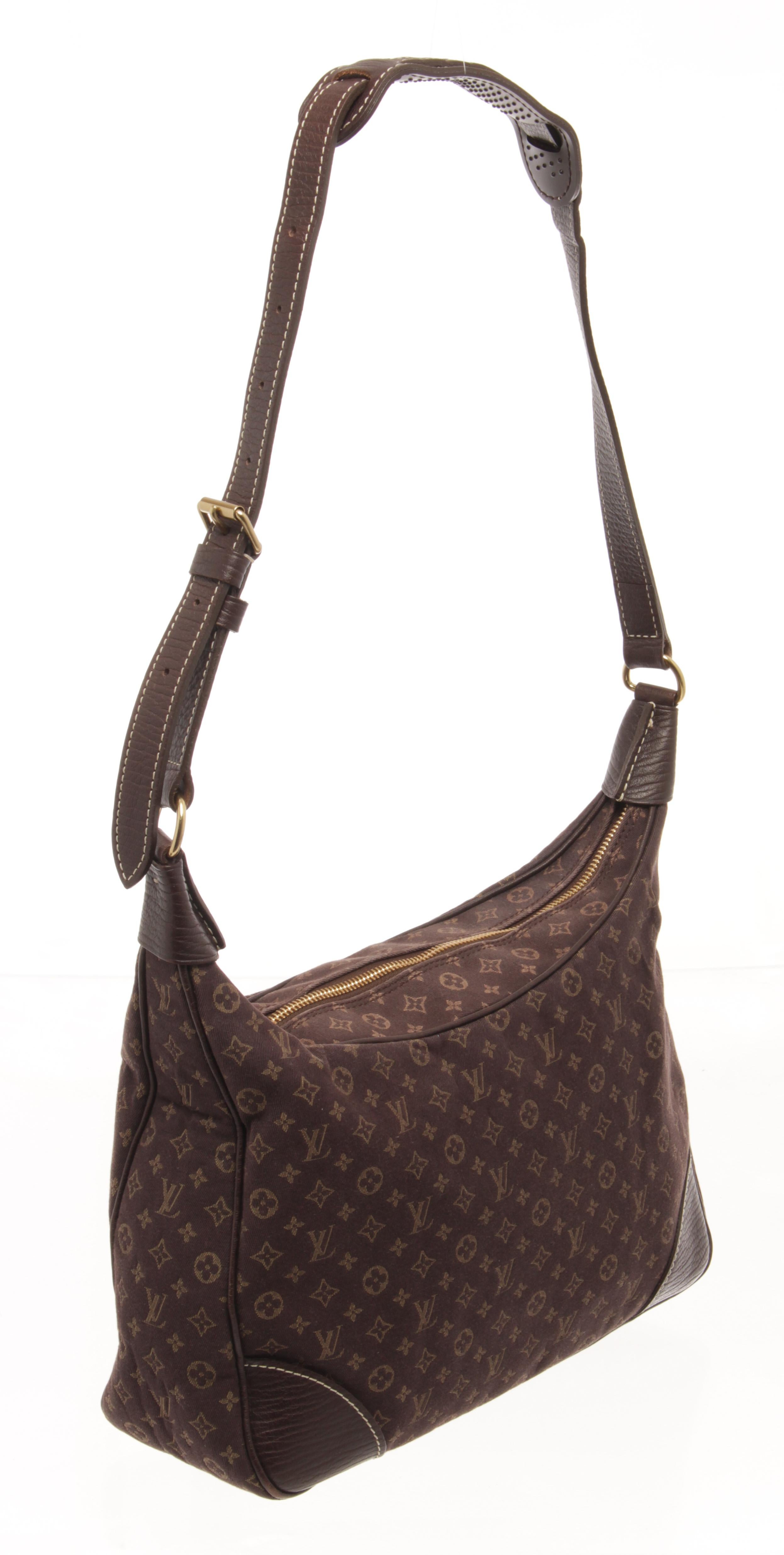 dark brown monogram mini lin canvas, this elegant shoulder bag with gold-tone hardware accents, its top zip closure opens to a brown fabric-lined interior with zip and slip pockets perfect for daily essentials.

87120MSC